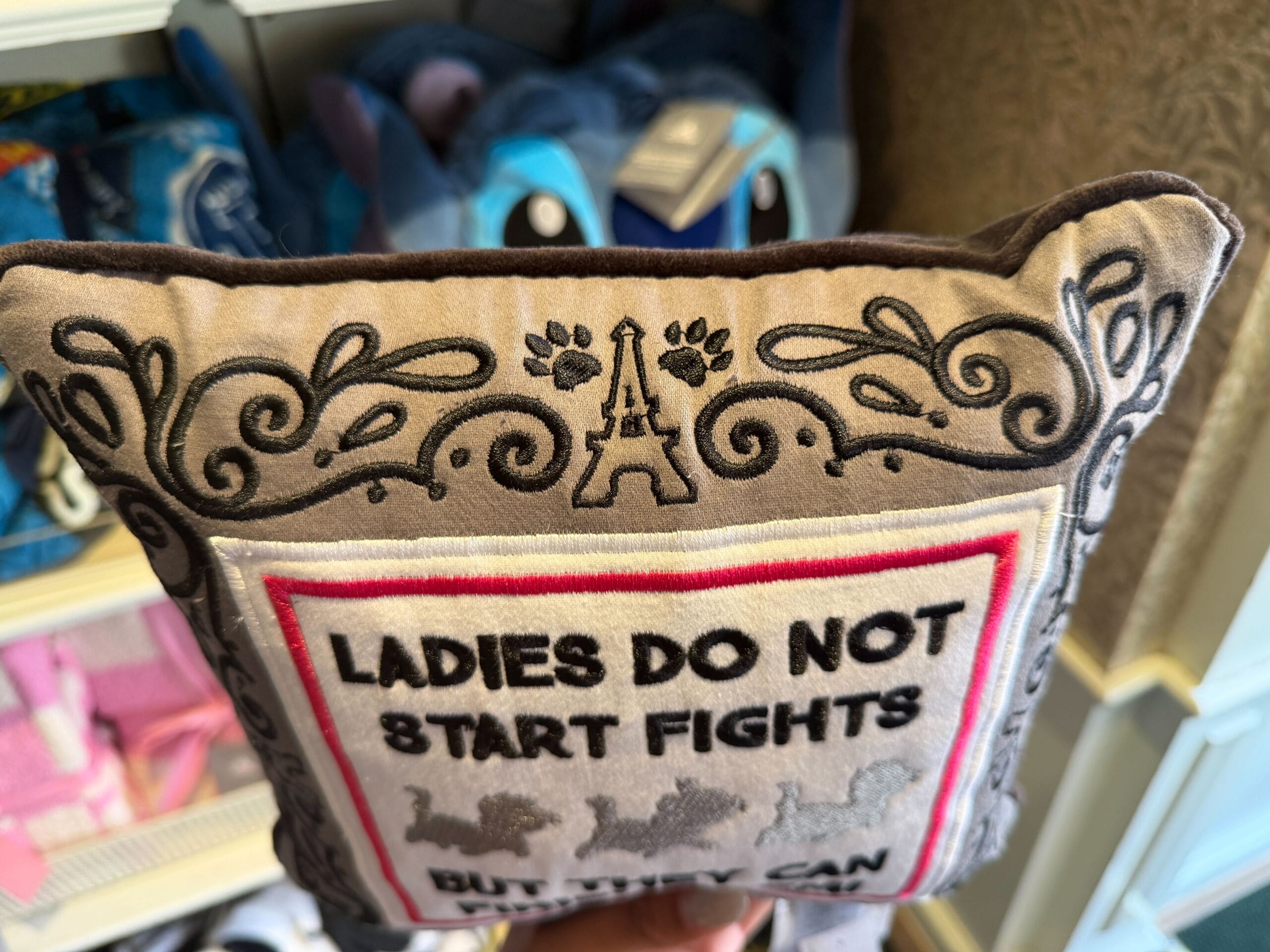Gray Aristocats throw pillow with the text "Ladies do not start fights but they can finish them!"