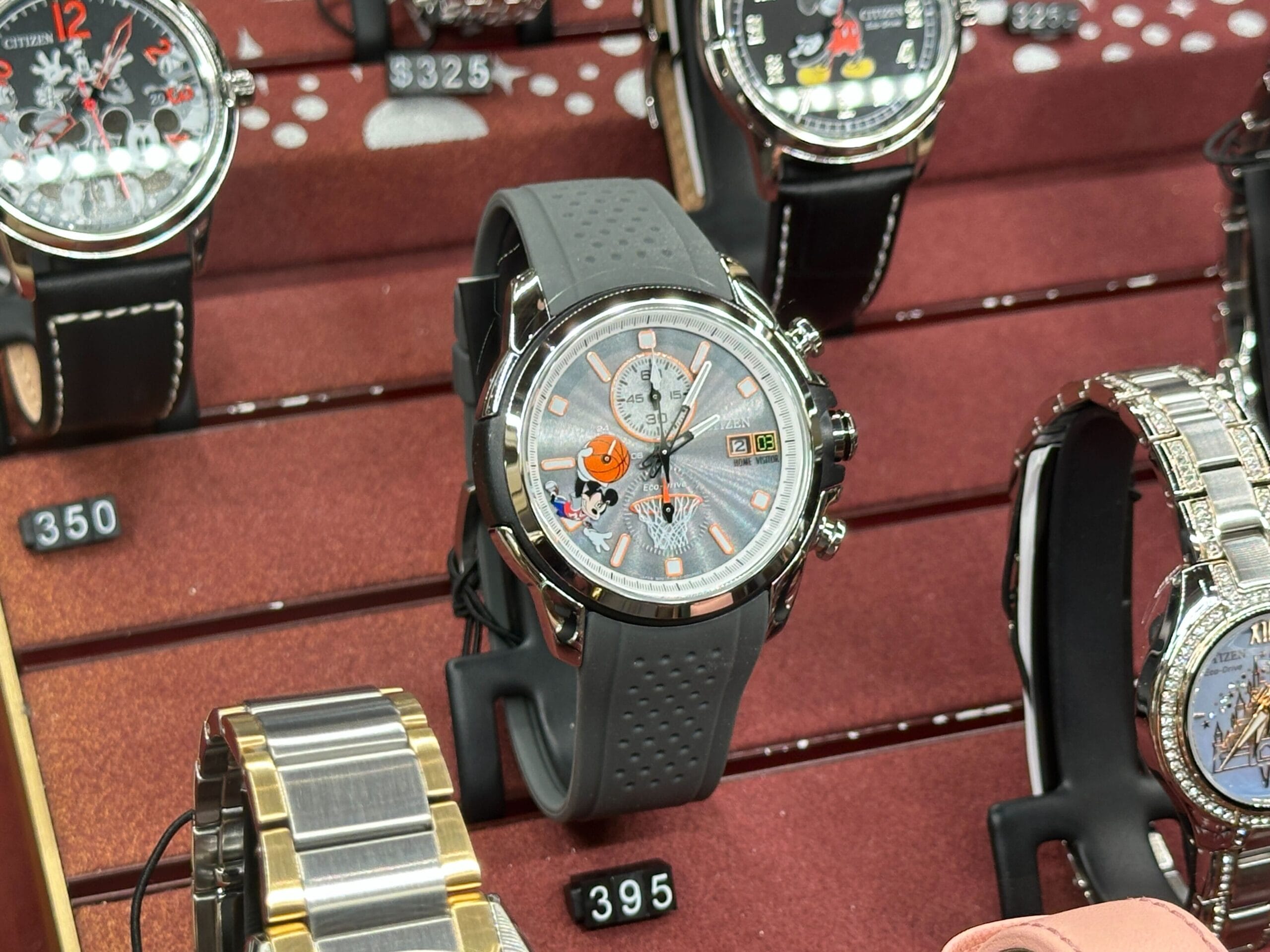 Silver Citizen watch featuring Mickey playing basketball