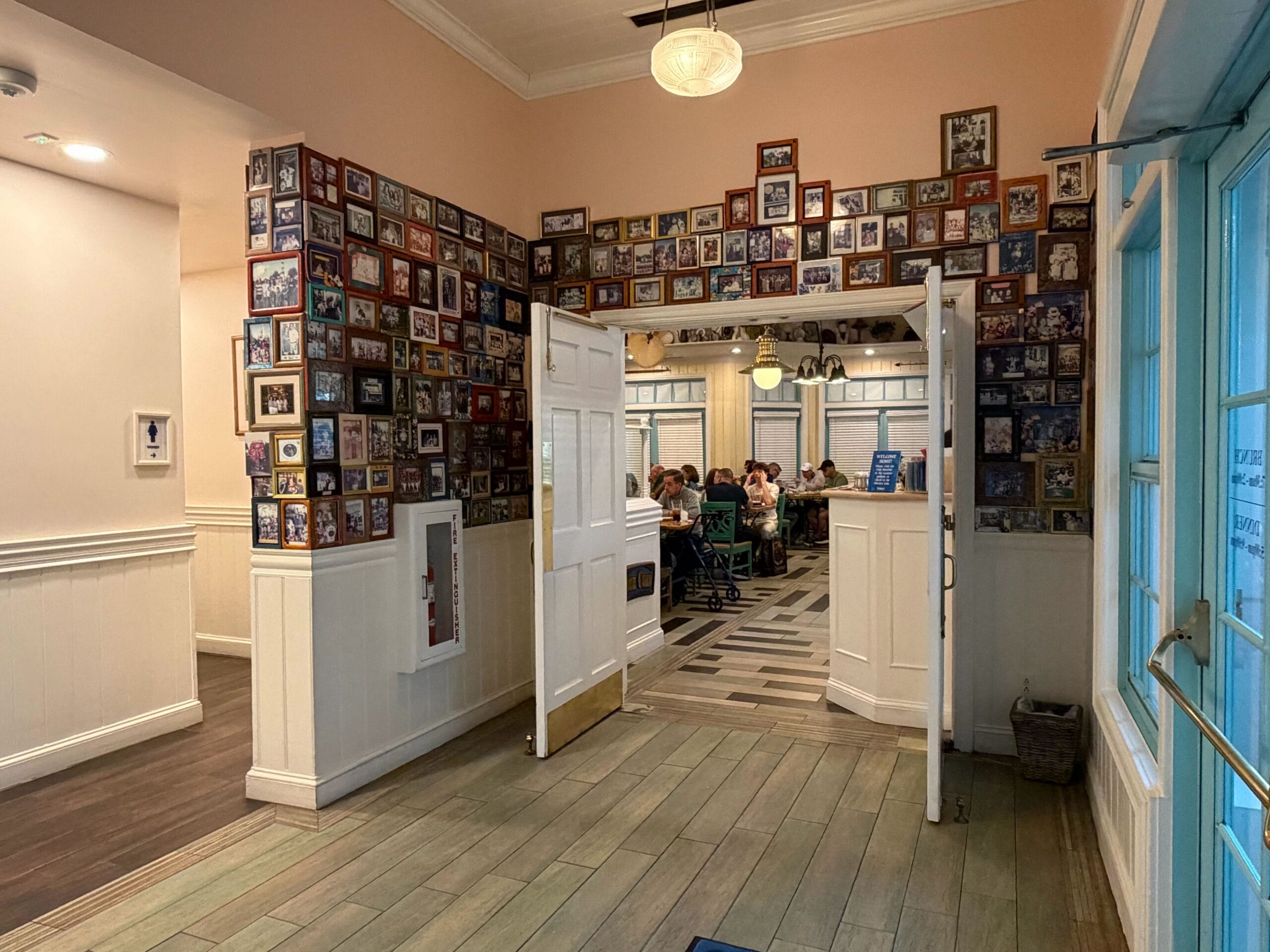 The DVC photo wall at Olivia's Cafe in Disney's Old Key West Resort in Walt Disney World