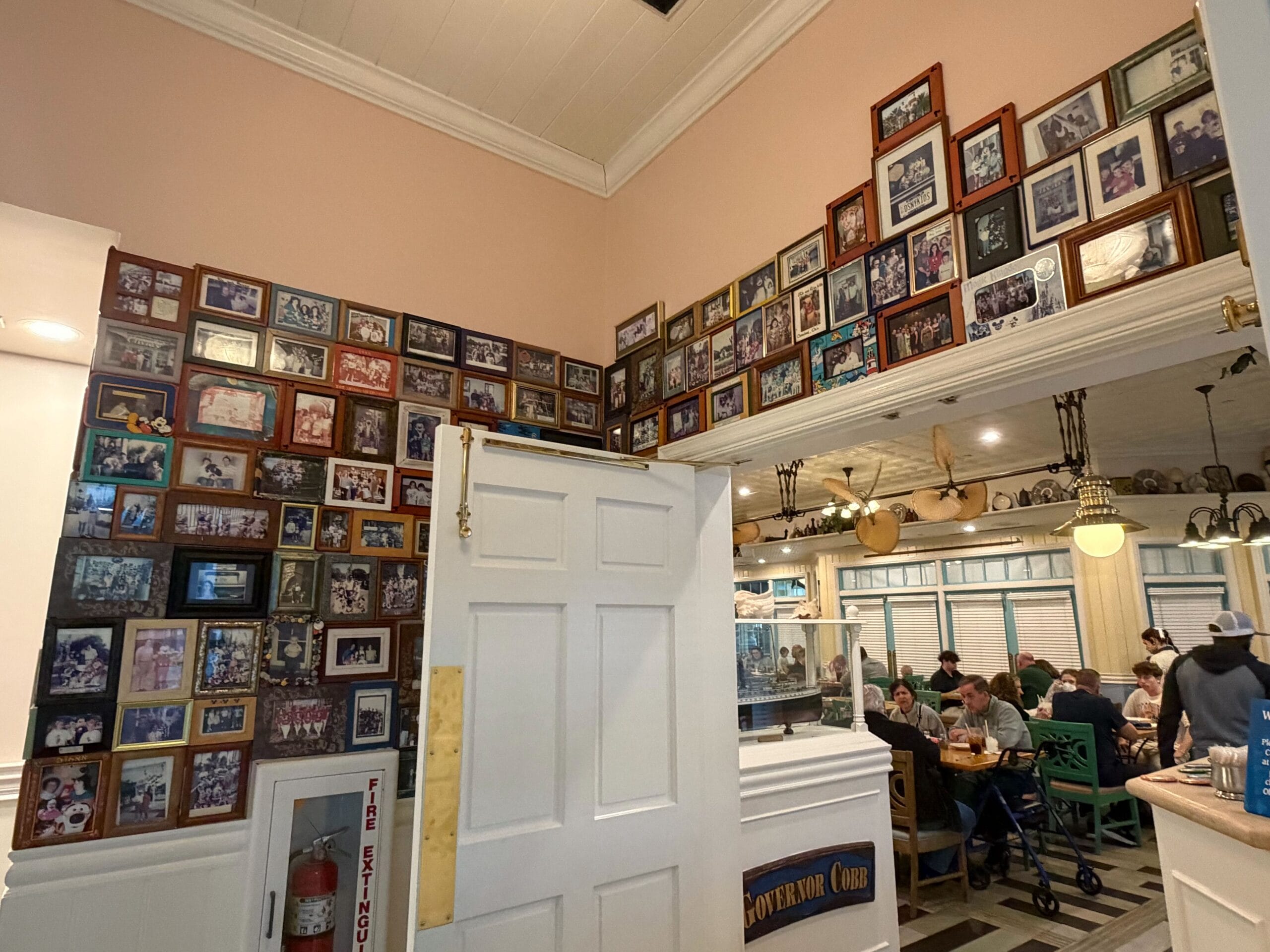 The DVC photo wall at Olivia's Cafe in Disney's Old Key West Resort in Walt Disney World