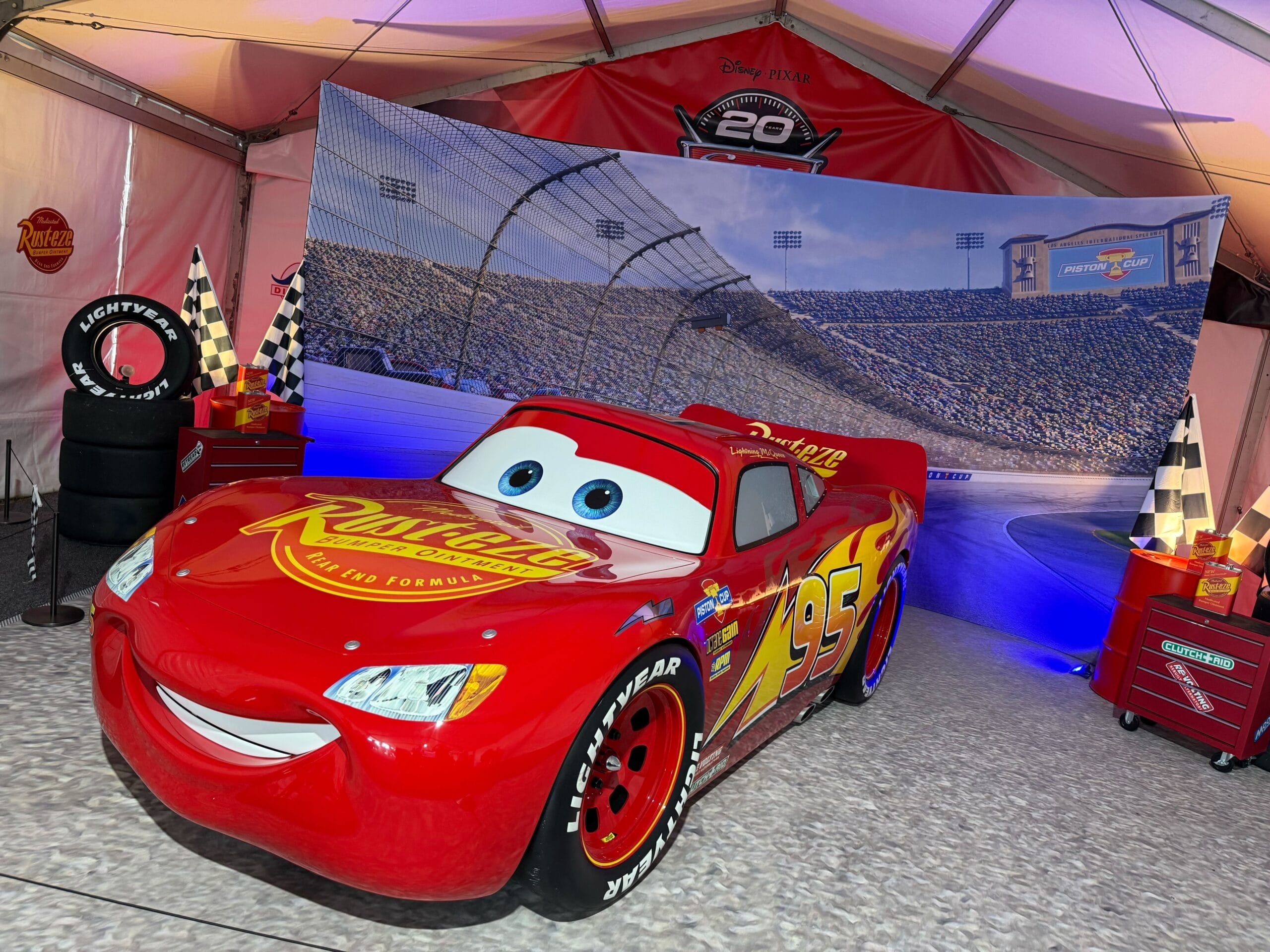 Lightning McQueen photo op in Cars 20th Anniversary tent at Daytona 500 2026