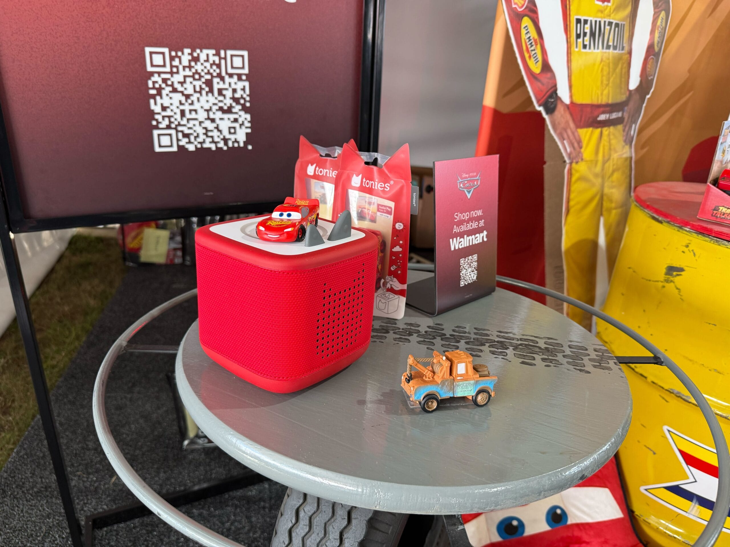 Display of Cars 20th Anniversary merchandise at Daytona 500 2026