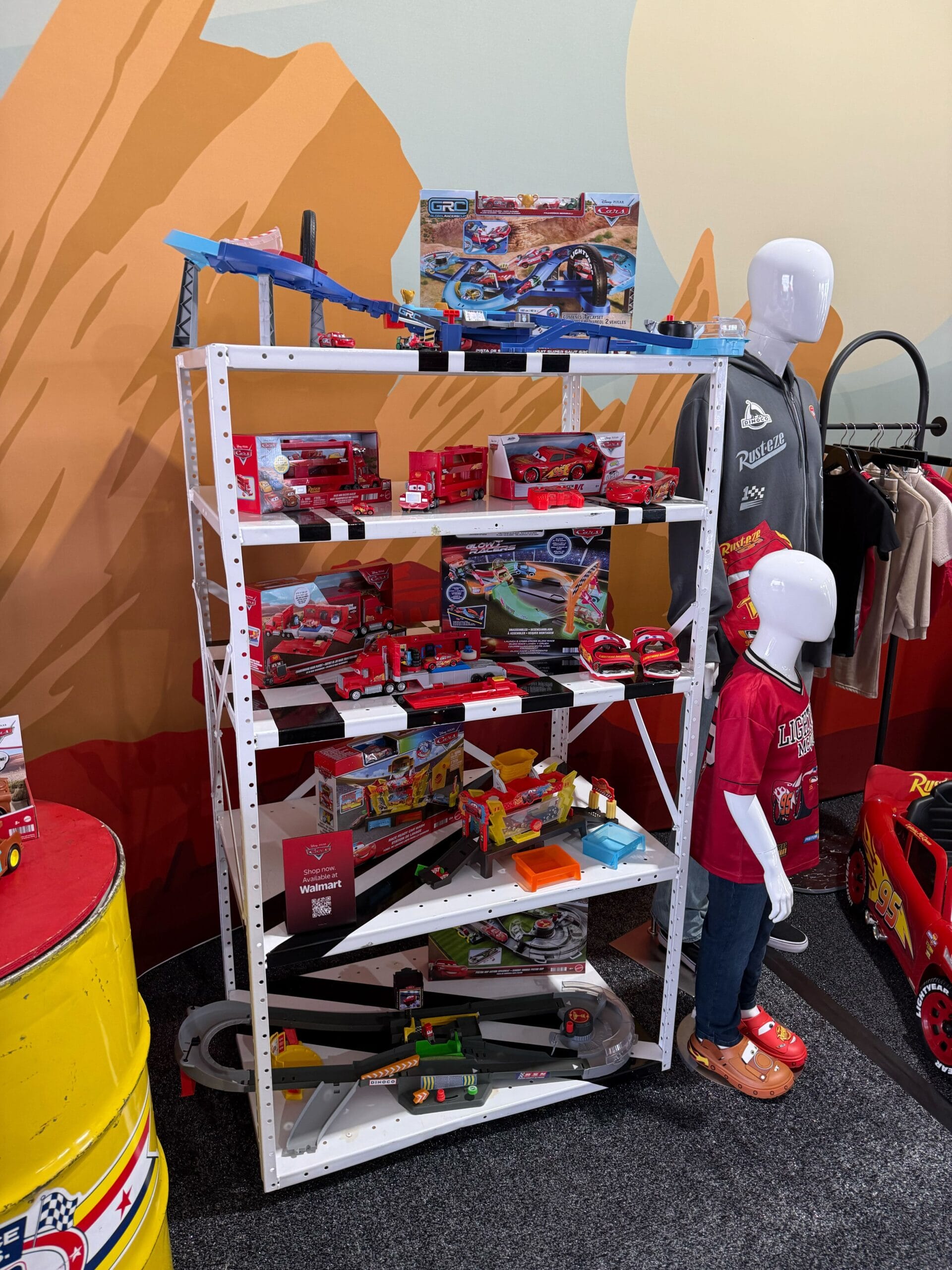 Display of Cars 20th Anniversary merchandise at Daytona 500 2026