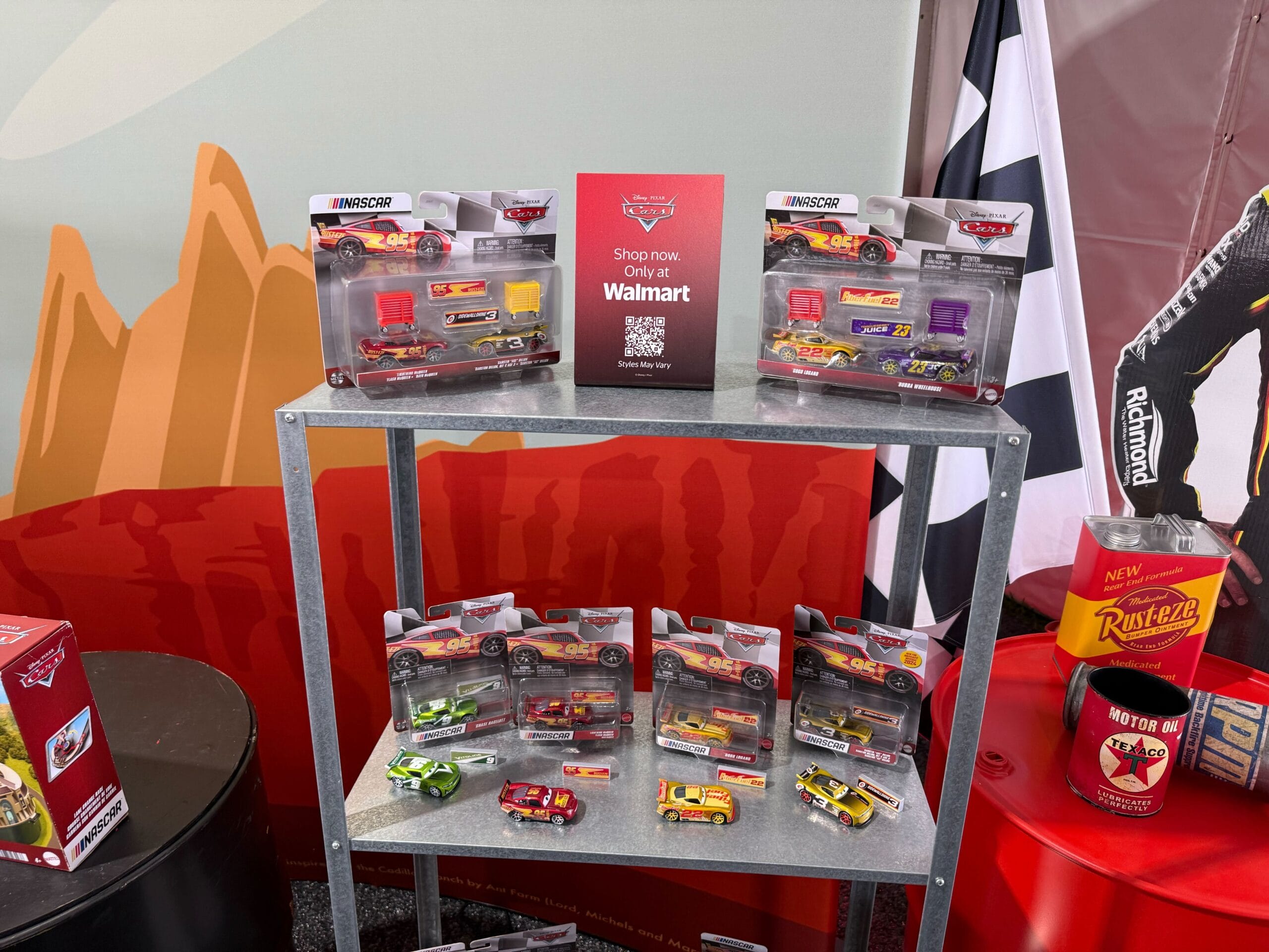 Display of Cars 20th Anniversary merchandise at Daytona 500 2026
