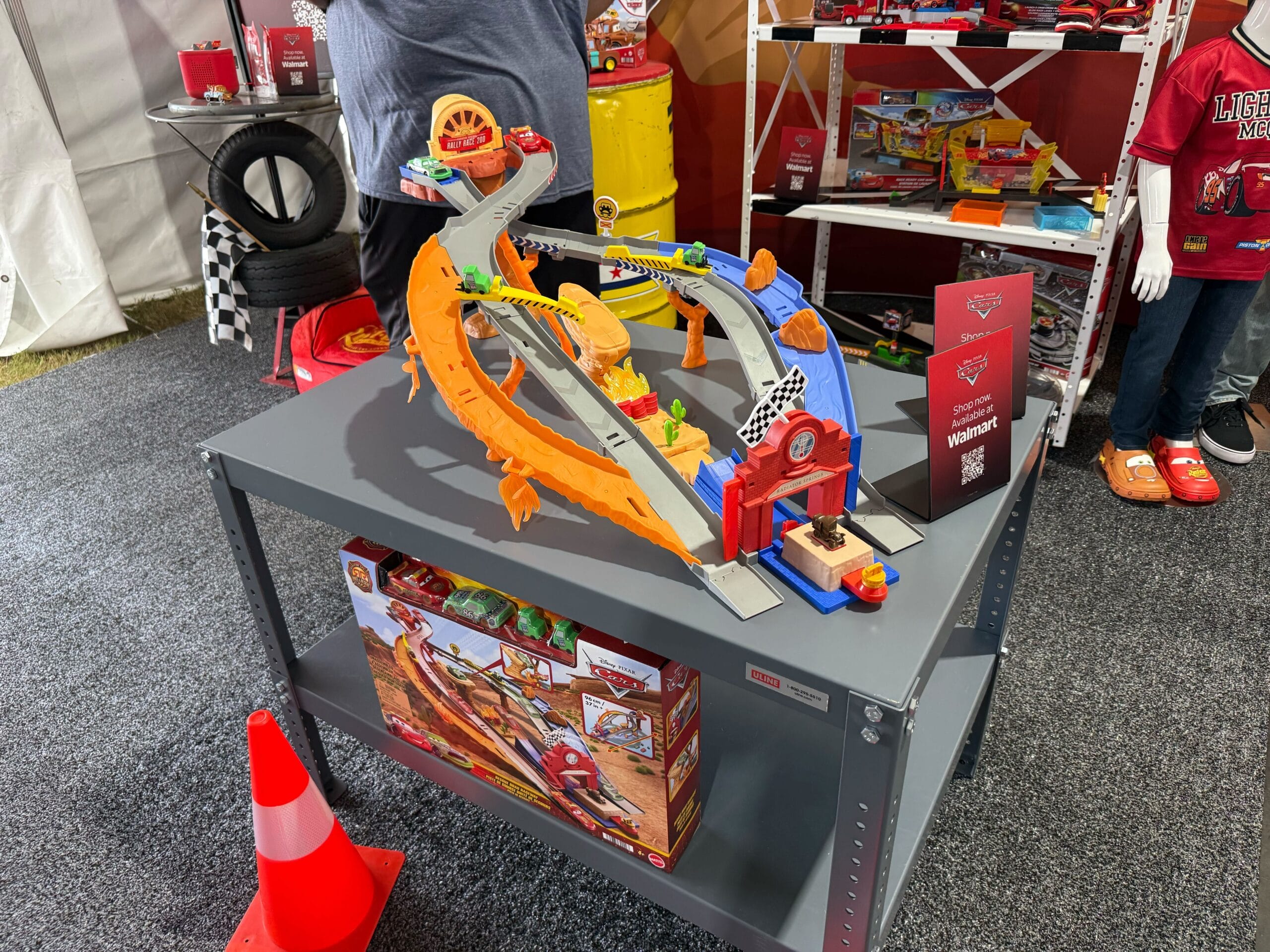 Display of Cars 20th Anniversary merchandise at Daytona 500 2026