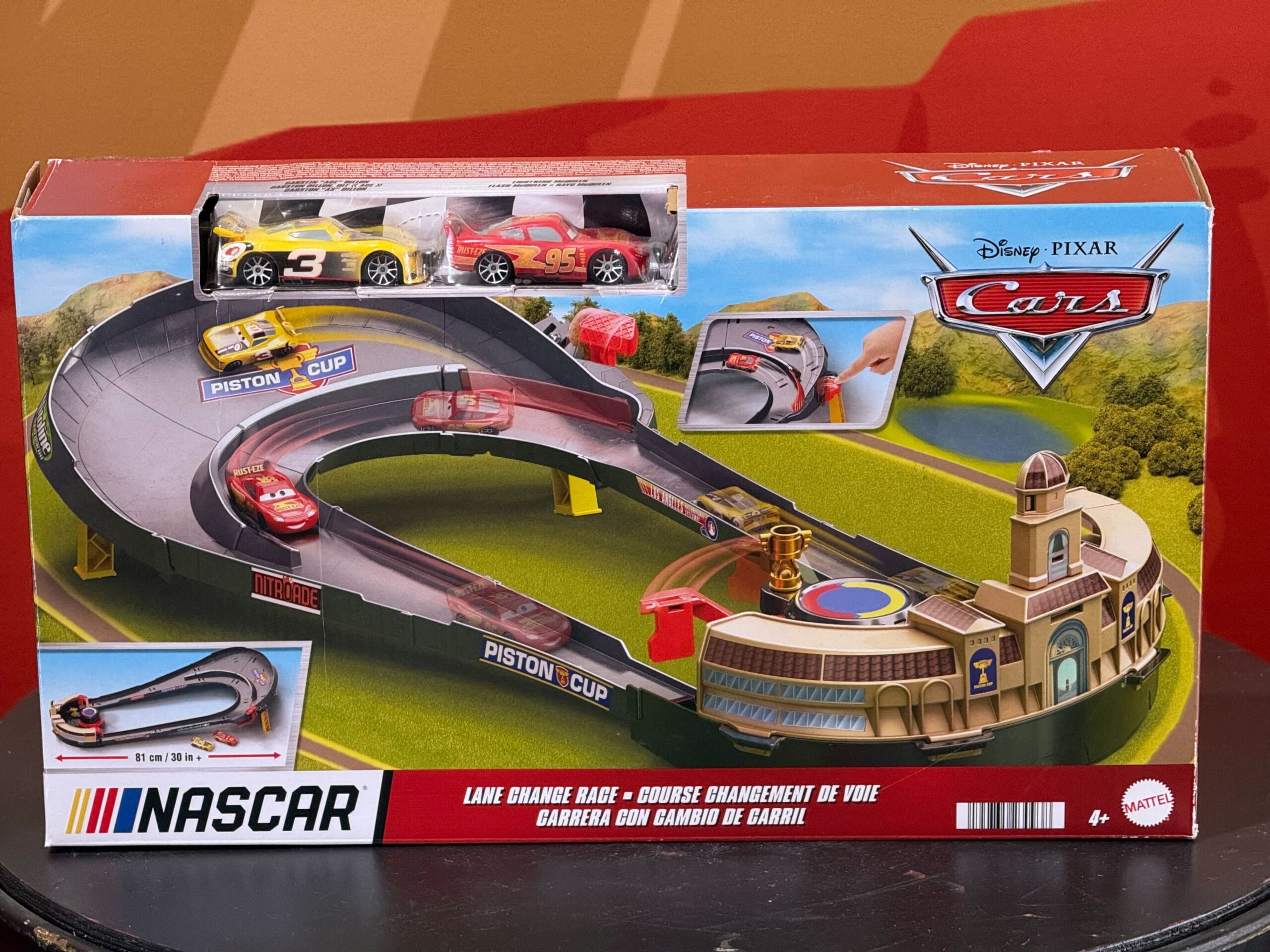 Display of Cars 20th Anniversary merchandise at Daytona 500 2026