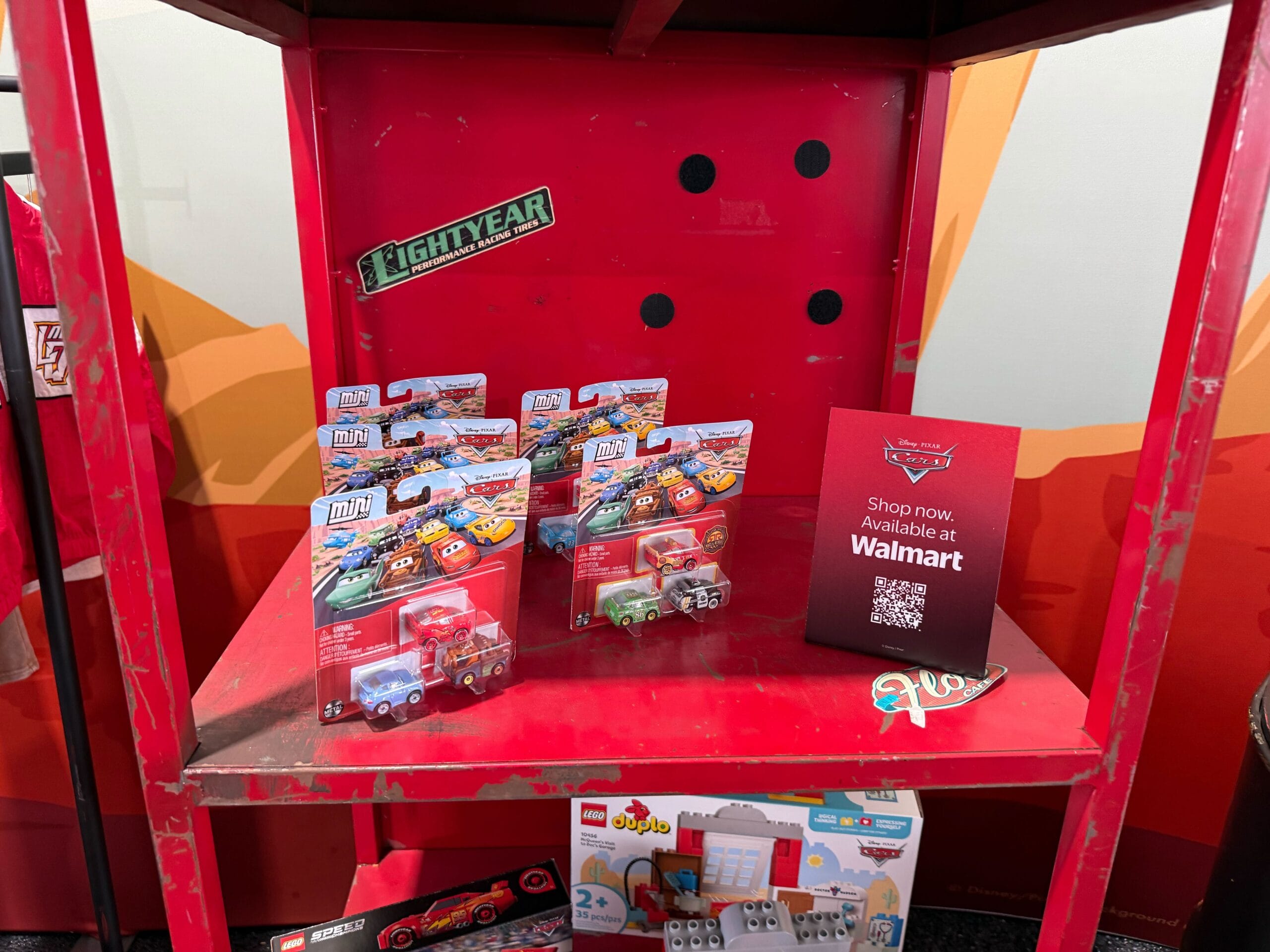 Display of Cars 20th Anniversary merchandise at Daytona 500 2026