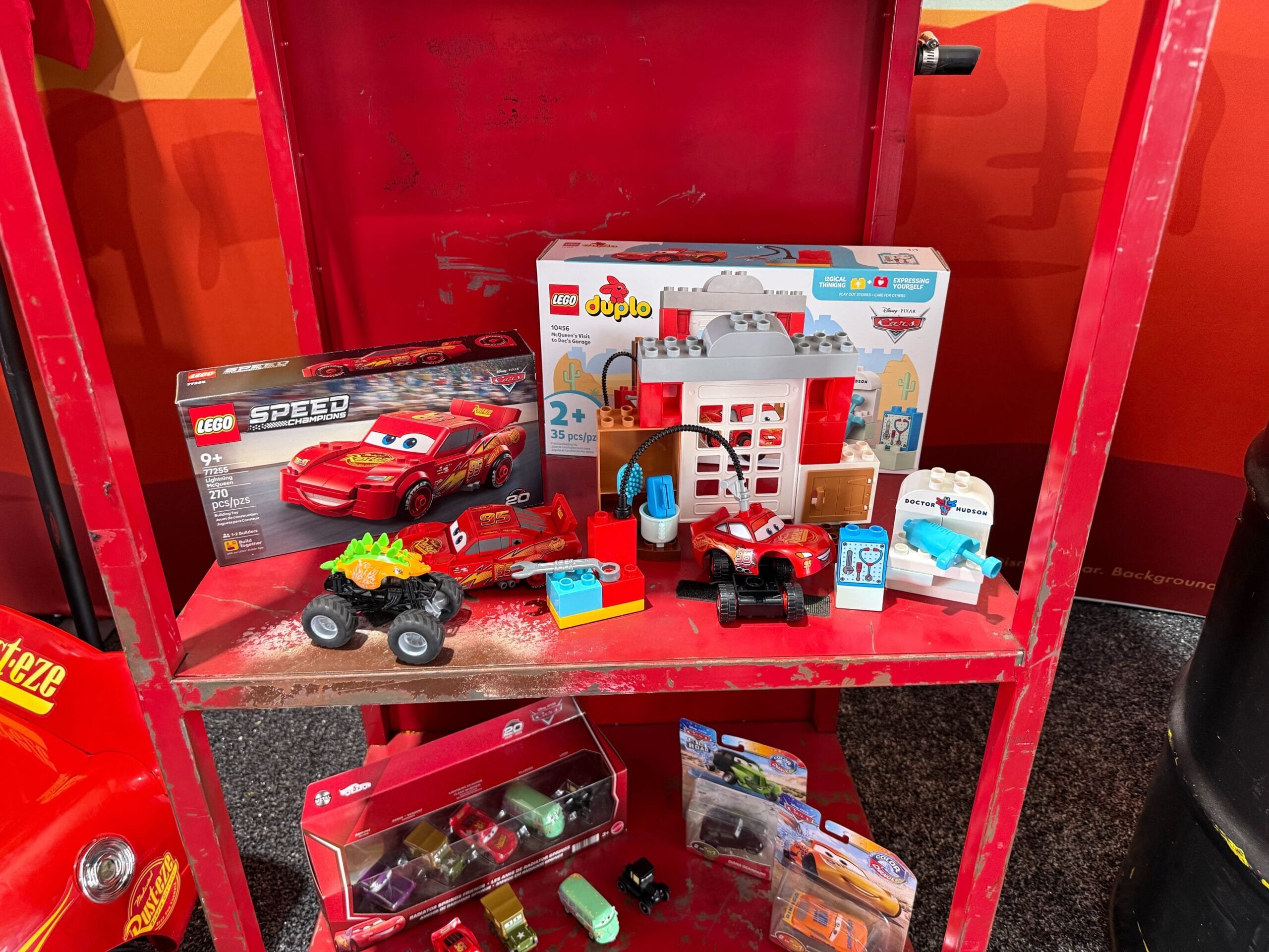 Display of Cars 20th Anniversary merchandise at Daytona 500 2026