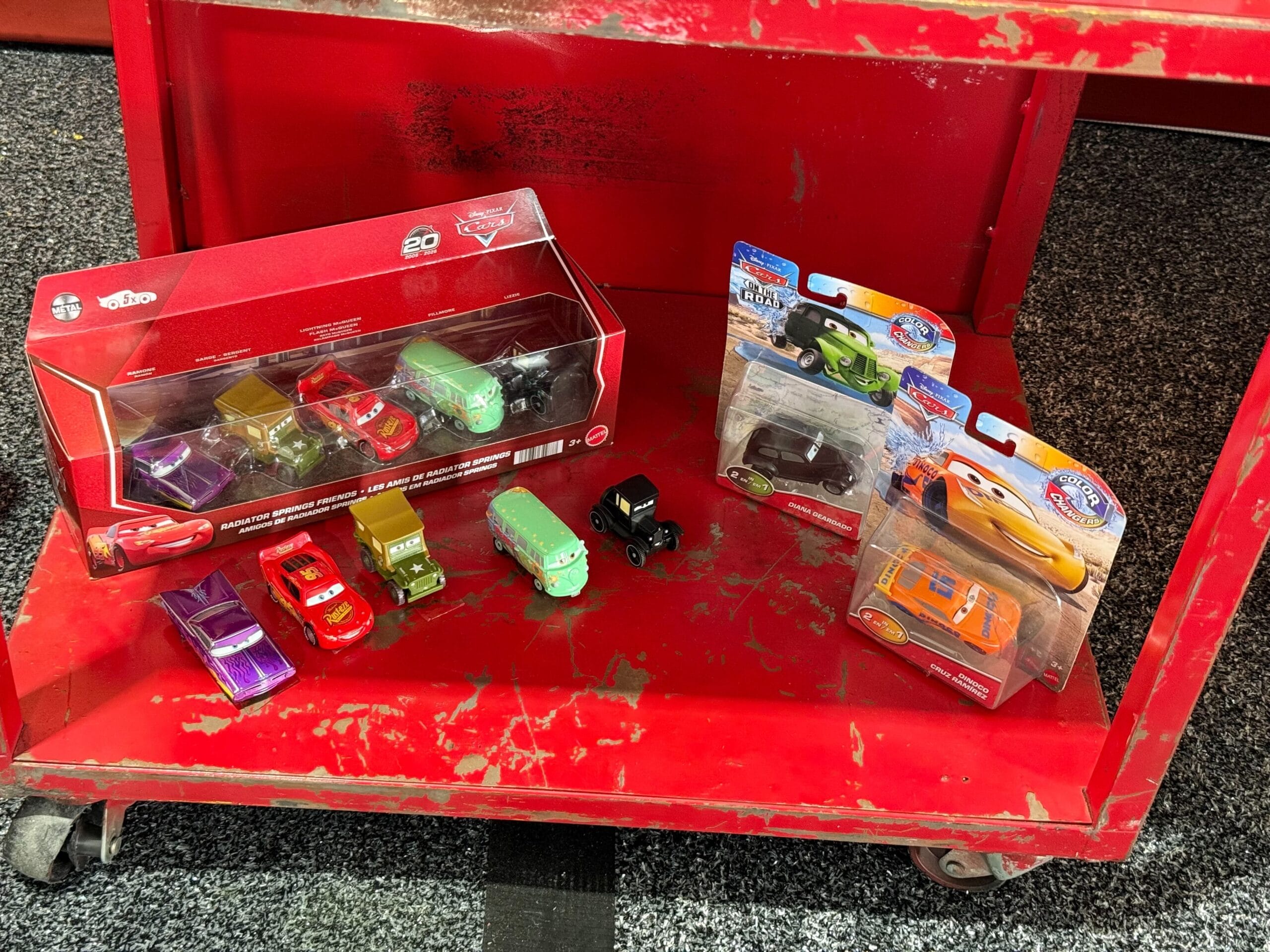 Display of Cars 20th Anniversary merchandise at Daytona 500 2026