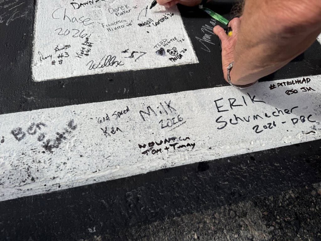 Signed Daytona 500 2026 start/finish line with "WDWNT.com"