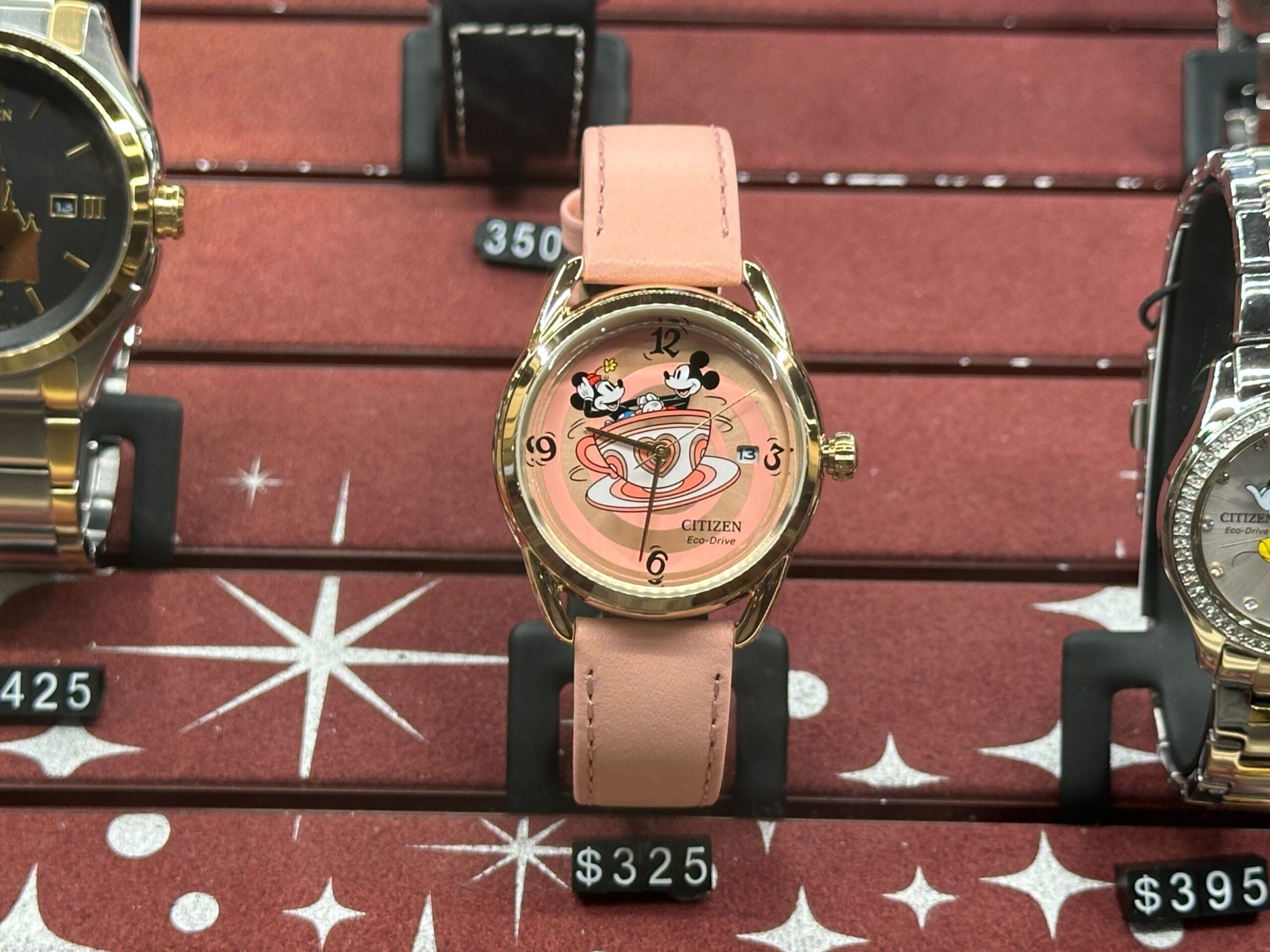 Pink Citizen watch featuring Mickey and Minnie riding in a Mad Tea Party teacup