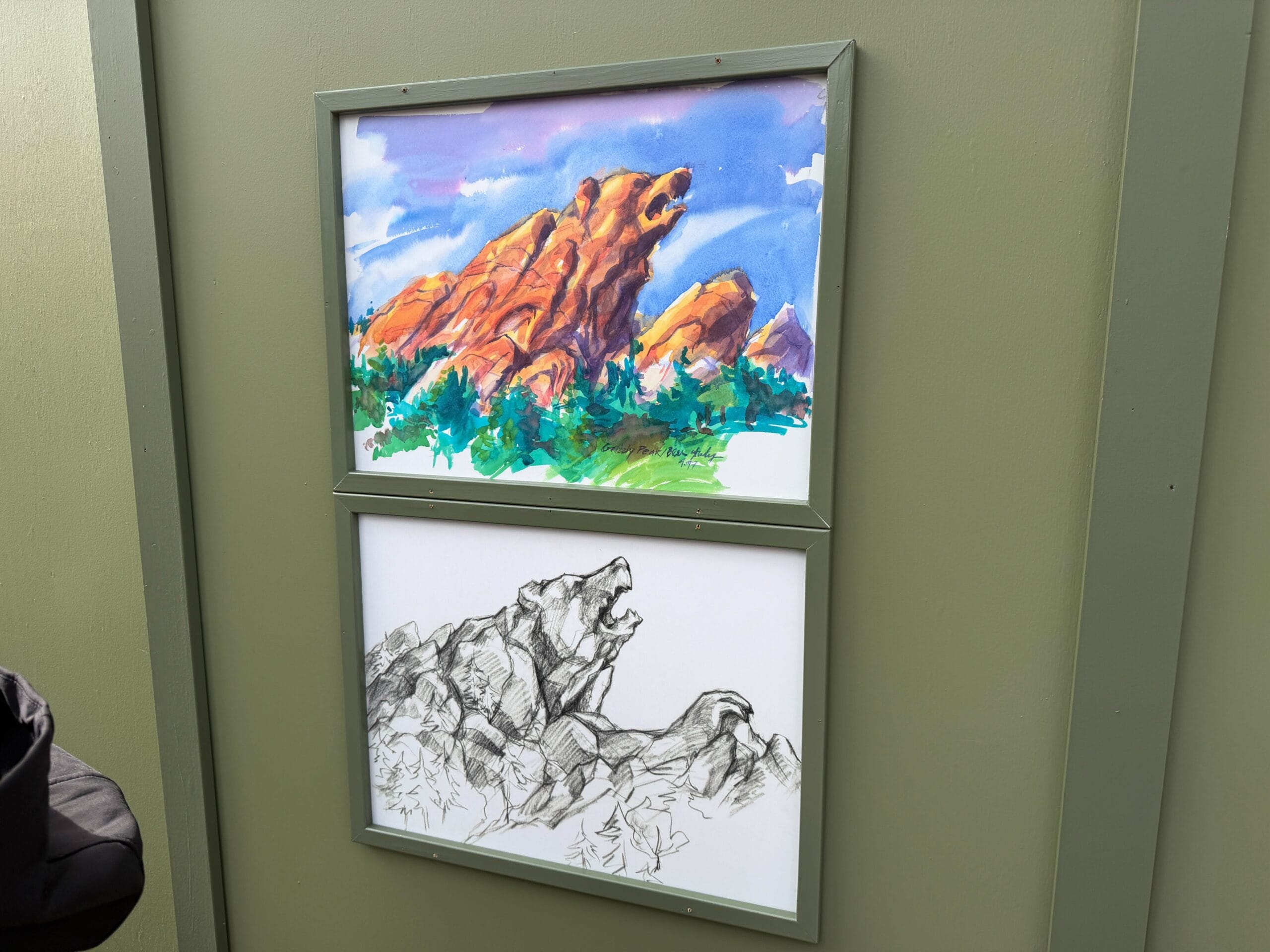 The last pair of art pieces depicts the more familiar Grizzly Peak mountain design in black-and-white and full watercolor.