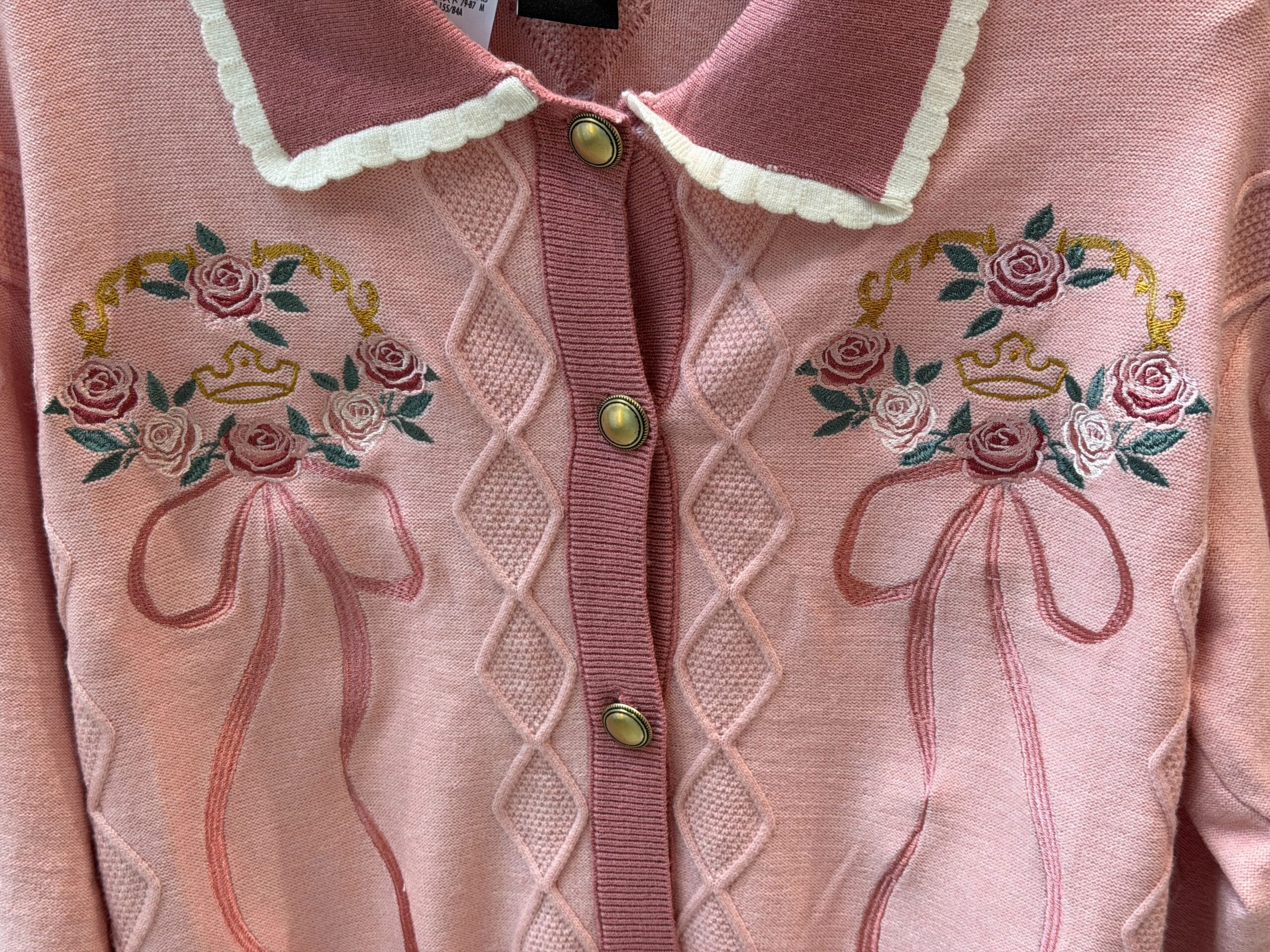 Close-up of front of Disney Princess Sweater.