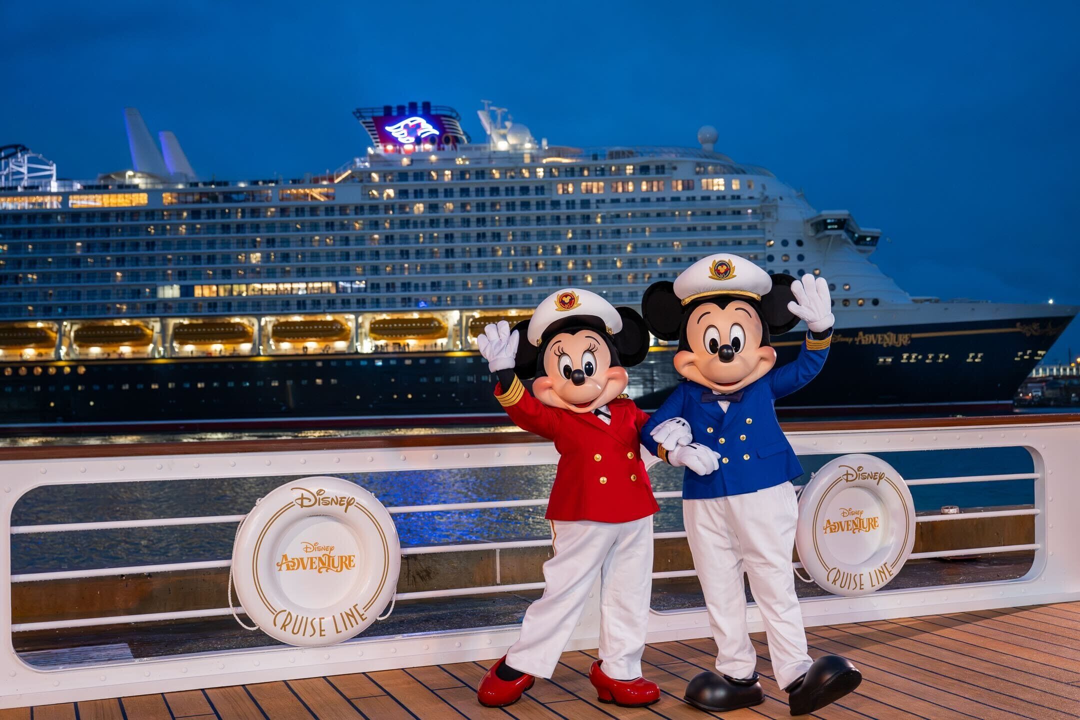 Captains Minnie and Mickey wave in front of the Disney Adventure cruise ship in Port Canaveral
