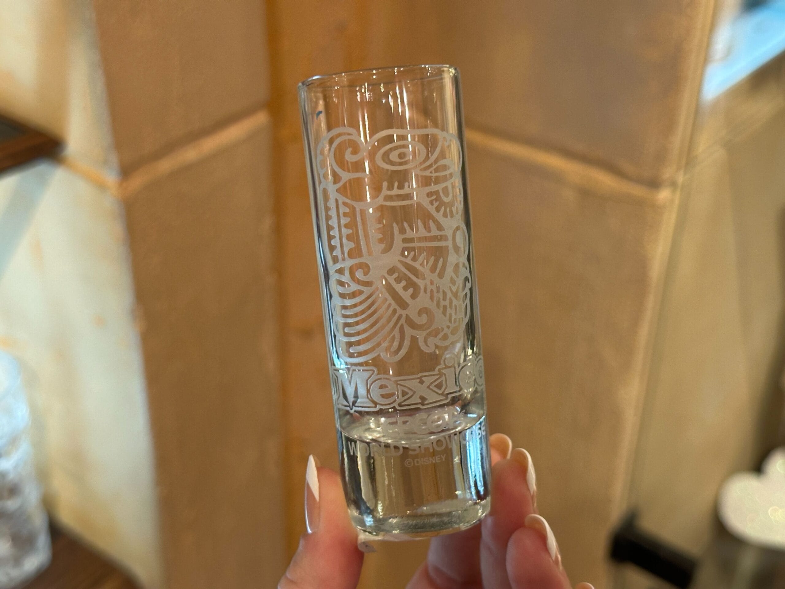 This straight shooter shot glass has the same "Mexico" and "EPCOT World Showcase" etched text on the bottom. It also features a Mayan Eagle etching above the words.