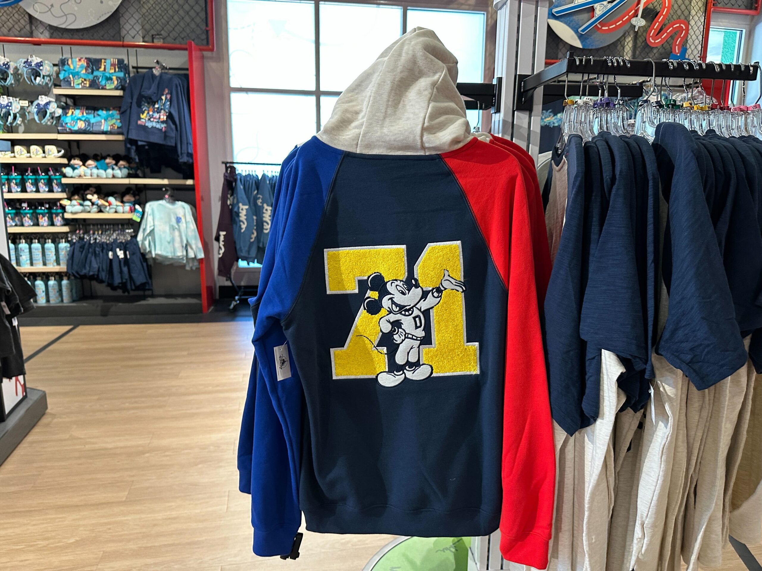 On the back is a large yellow chenille "71." Mickey is in black and white in front of the number, wearing his same "D" sweater.