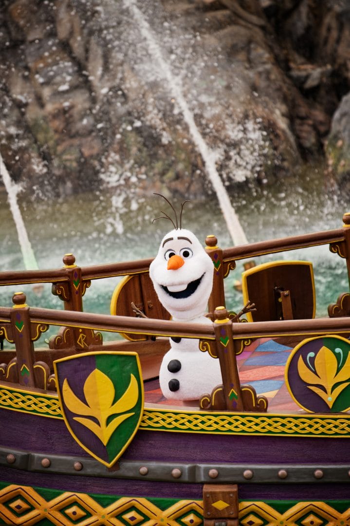 The self-walking robotic Olaf on a boat during the Snowflower Festival show in World of Frozen at Disneyland Paris