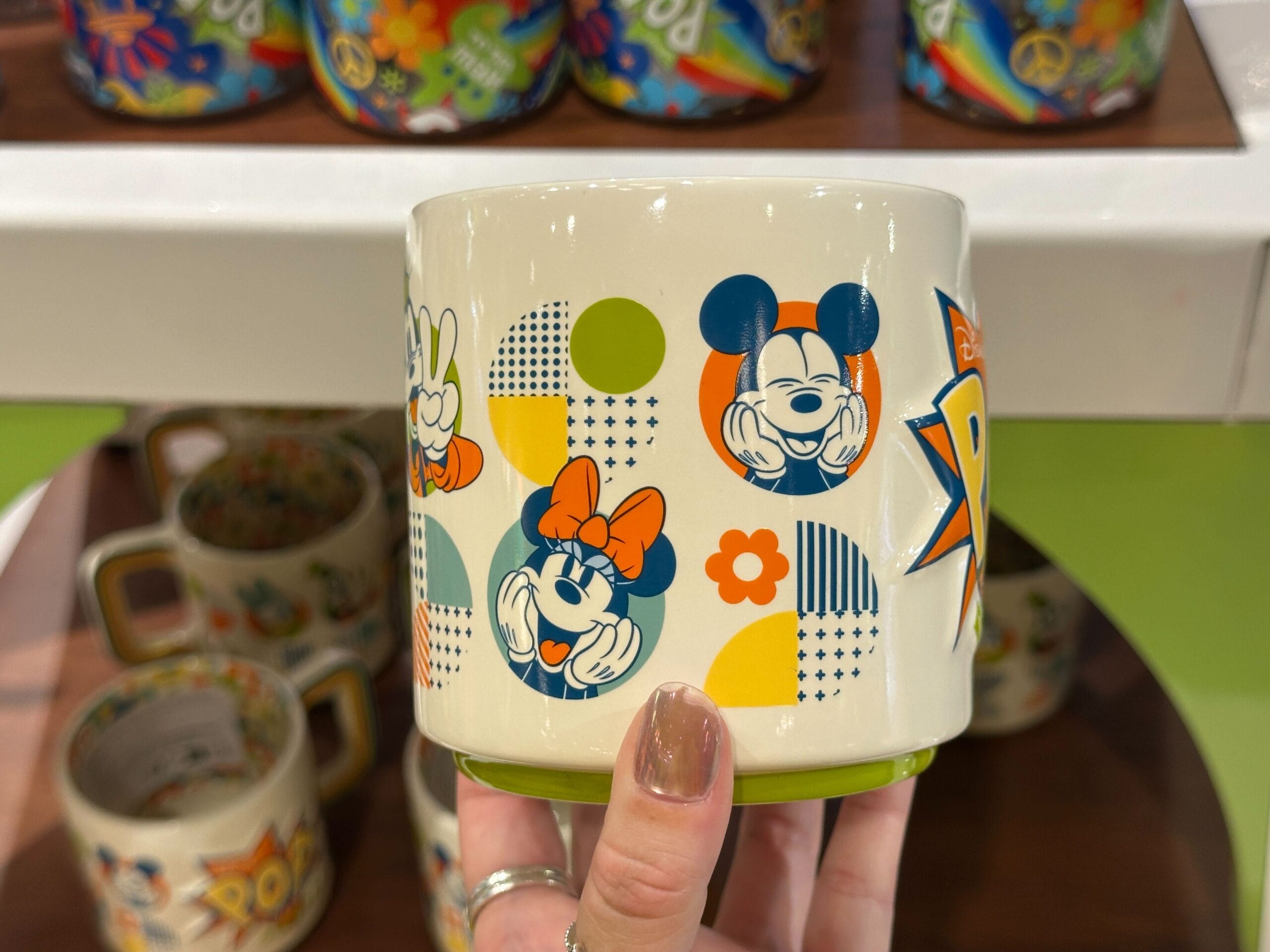 A new Pop Century-specific mug is available at Walt Disney World. It has a retro design and features the Sensational Six.