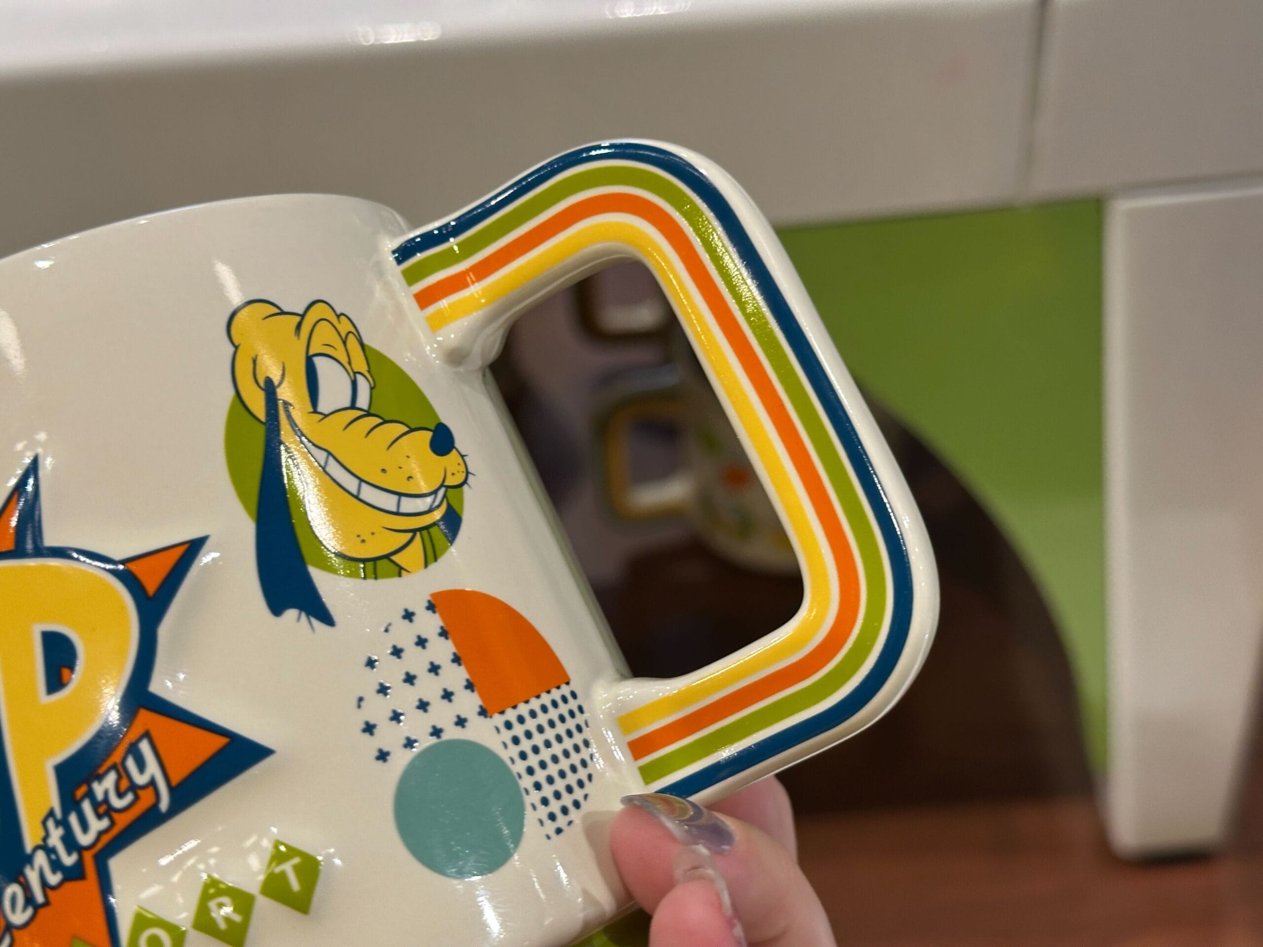 A new Pop Century-specific mug is available at Walt Disney World. It has a retro design and features the Sensational Six.