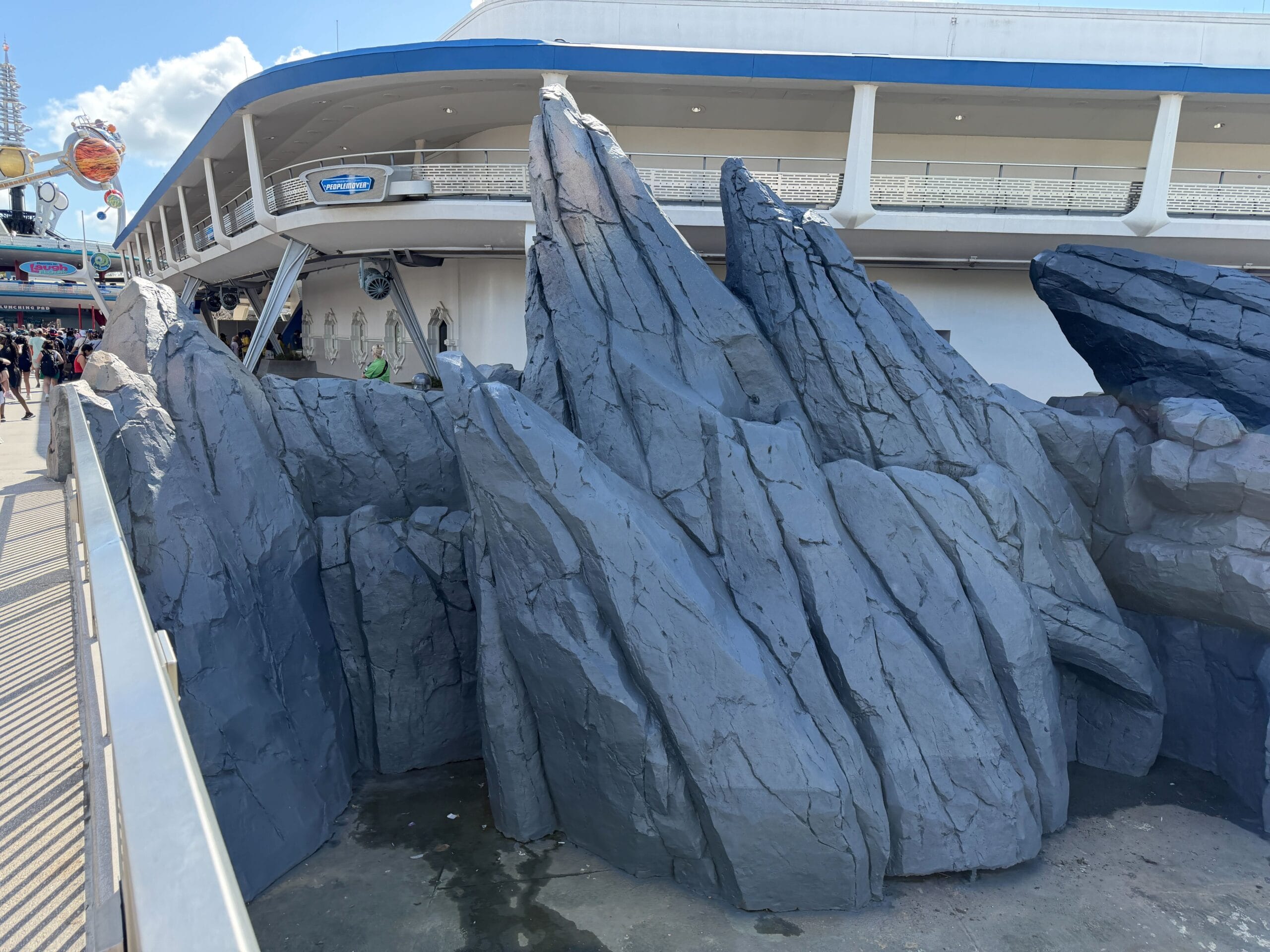 Tomorrowland rocks repainted to metallic blue in Magic Kingdom at Walt Disney World