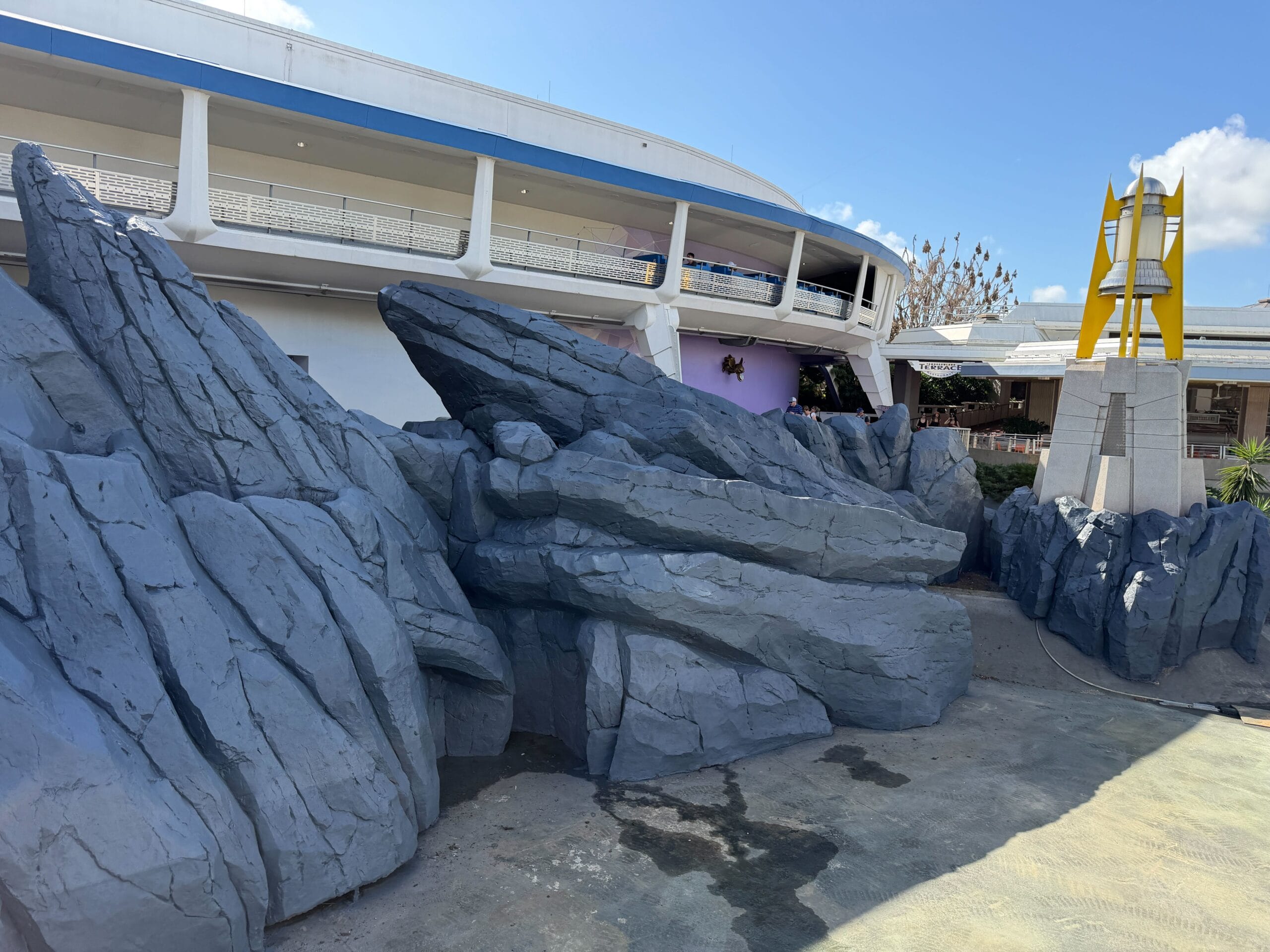 Tomorrowland rocks repainted to metallic blue in Magic Kingdom at Walt Disney World