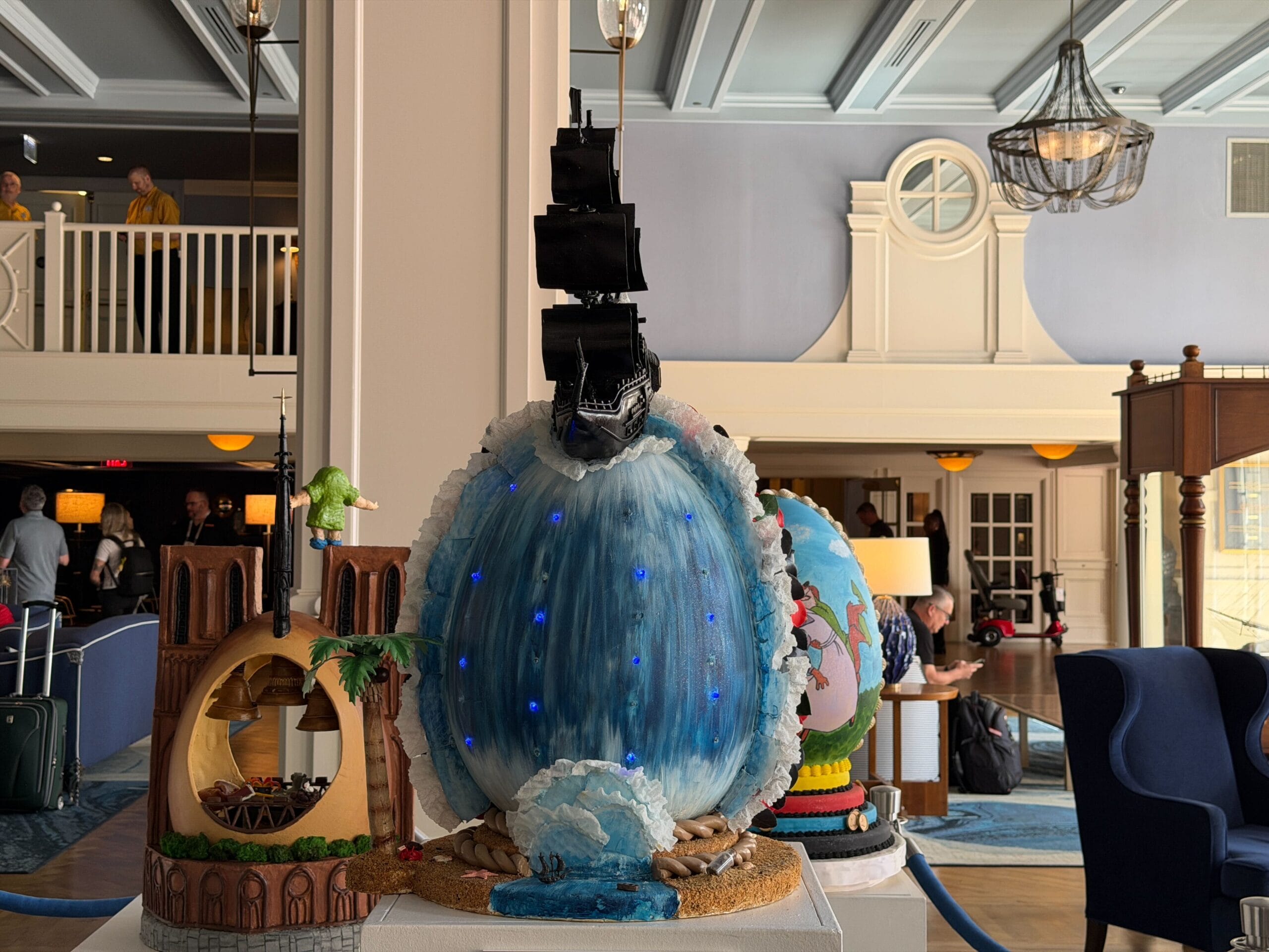 The fifth egg is inspired by Pirates of the Caribbean: At World's End, namely the scene where they go over the edge of the world. The egg is decorated as the ocean, as the Black Pearl sails on top of it. Lights are present inside the egg.