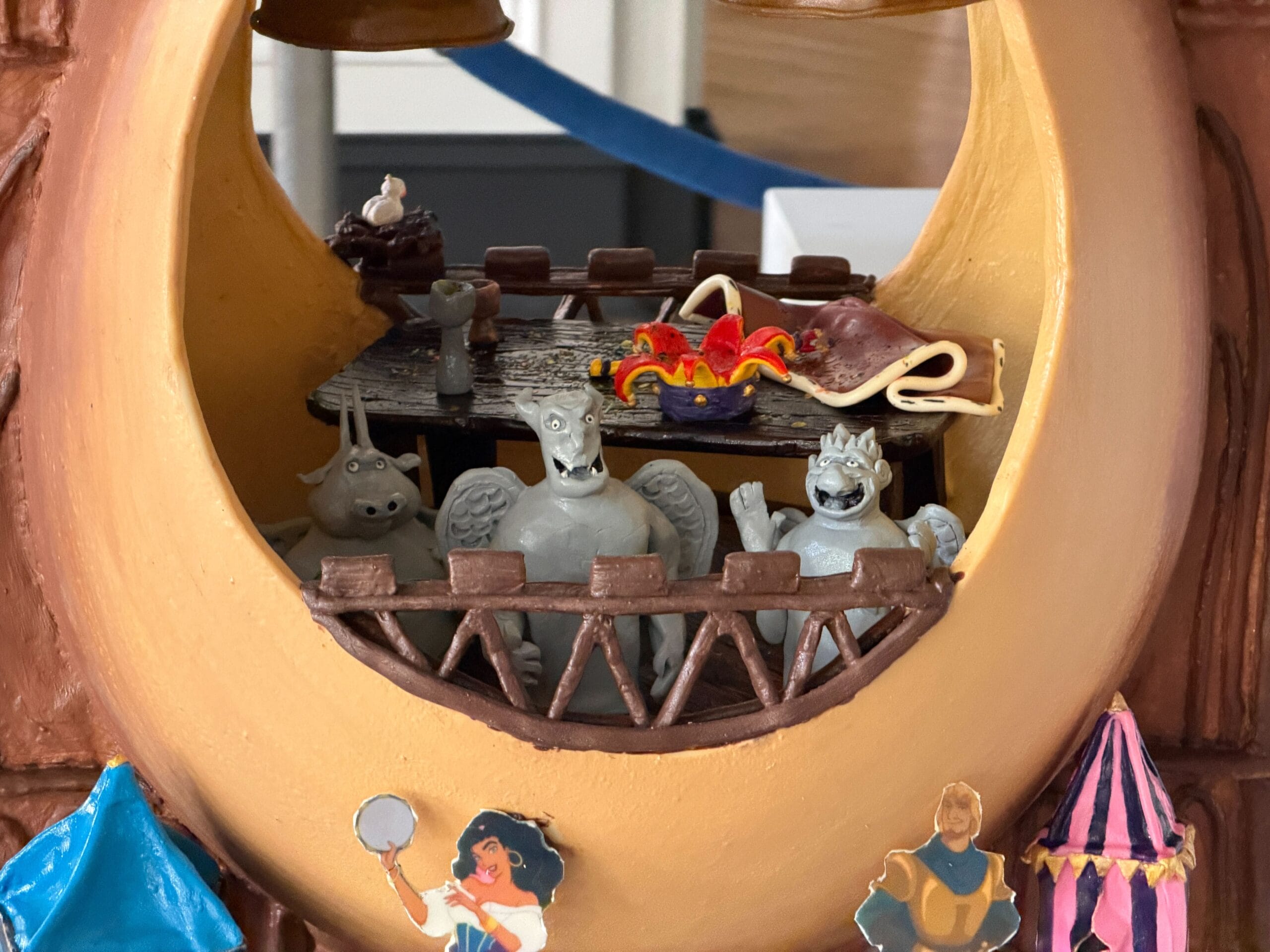 The third display is inspired by the 'Hunchback of Notre Dame'. Notre Dame is represented with its two signature towers, while the egg is the middle part, and hollow. Esmeralda, Captain Phoebus, and her goat are standing on the street, while Quasimodo is T-posing on top of one of the towers.