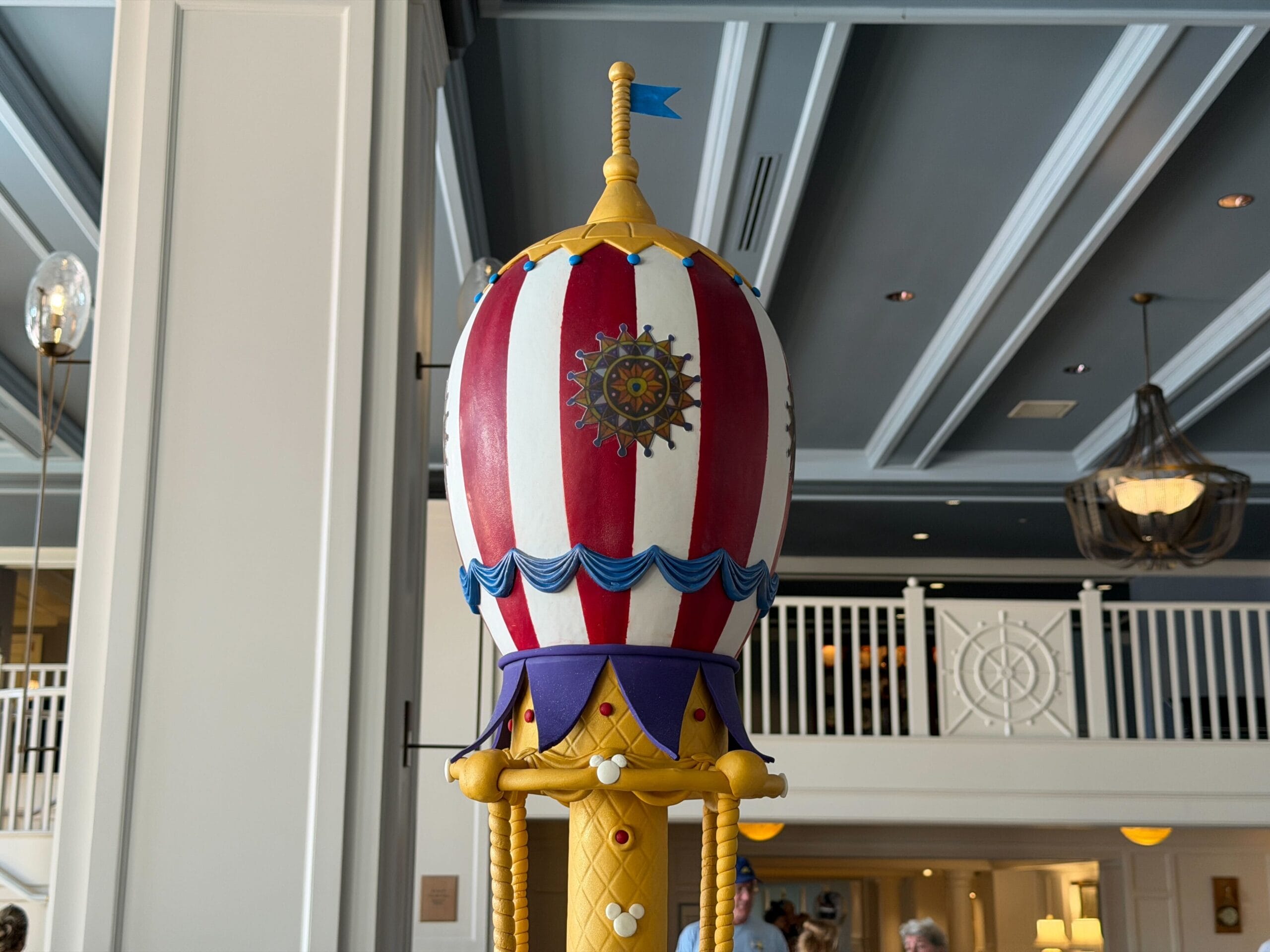 The second egg draws its inspiration from the 'Festival of Fantasy' parade at the Magic Kingdom, namely the final float where Mickey and Minnie stand in a giant hot air balloon.