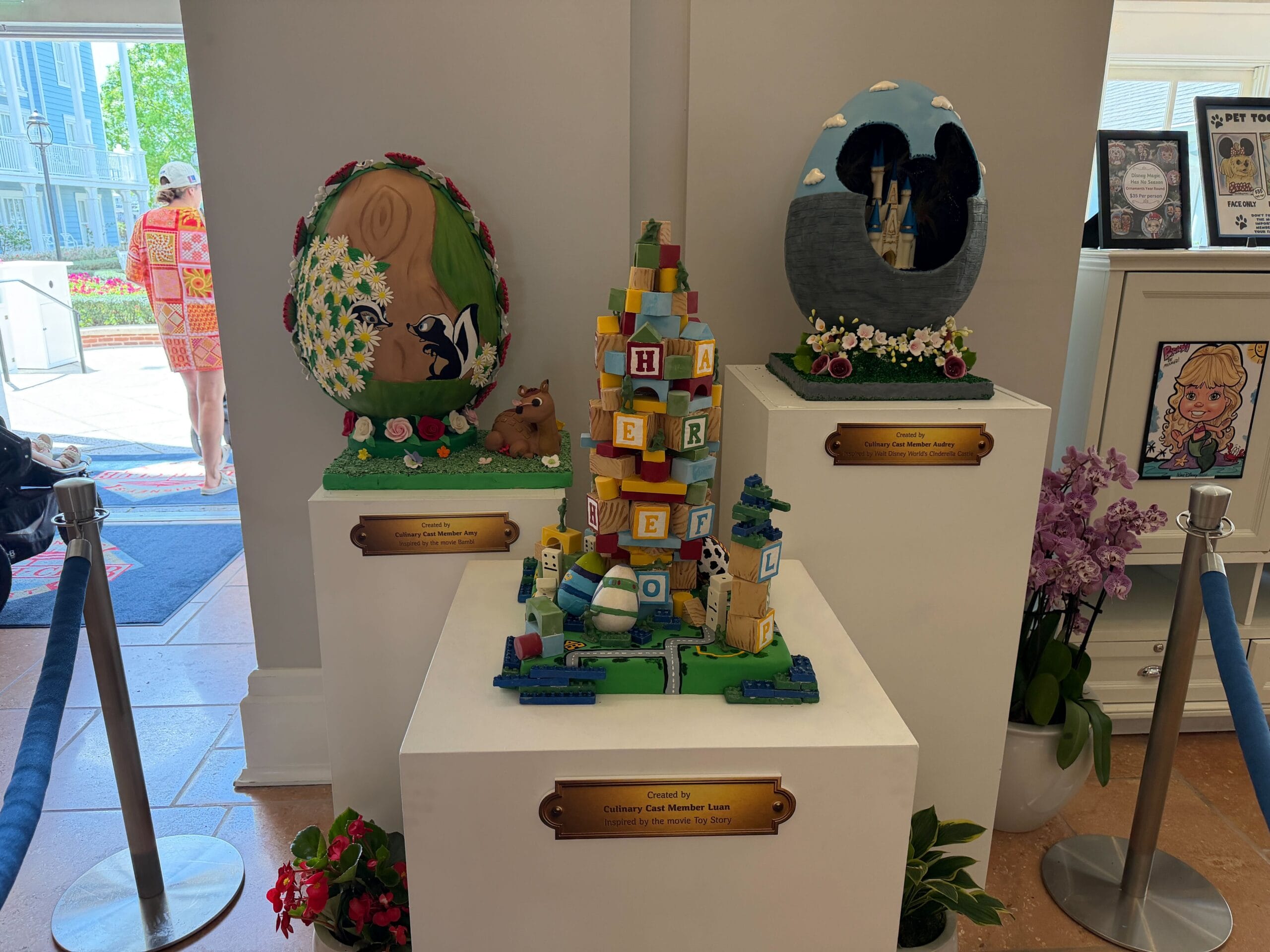 The first display is a block tower inspired by the Toy Story franchise. Eggs reminiscent of Buzz Lightyear and a Little Green Man can be seen at the base. Other eggs are visible at the base, while green army men are patrolling the top of the tower. The alphabet blocks appear to have been put there at random.