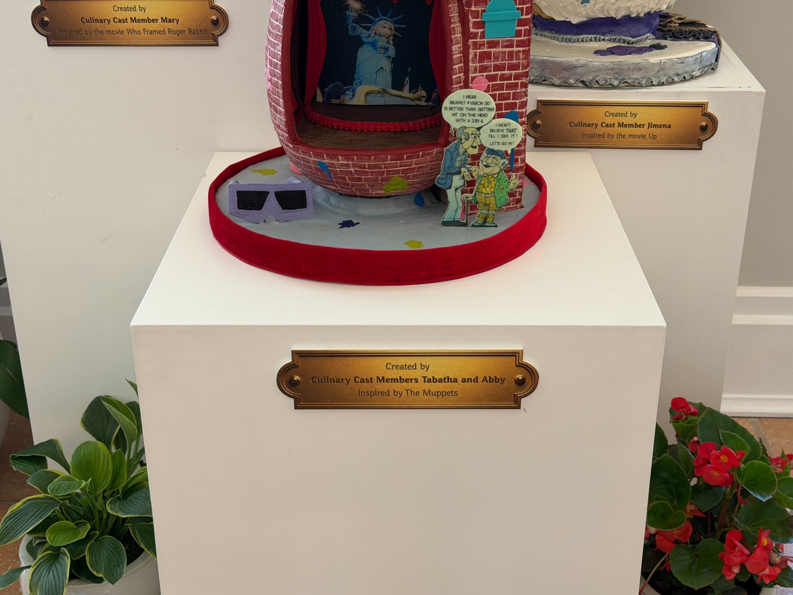 The first egg is inspired by a former attraction, MuppetVision 3-D. The egg is in the shape of the building, complete with the original logo and balloon on top of the clock tower, which was later removed due to sightline issues with Galaxy's Edge. Statler and Waldorf's cut-out which was at the front of the building is present, as are the 3-D glasses.