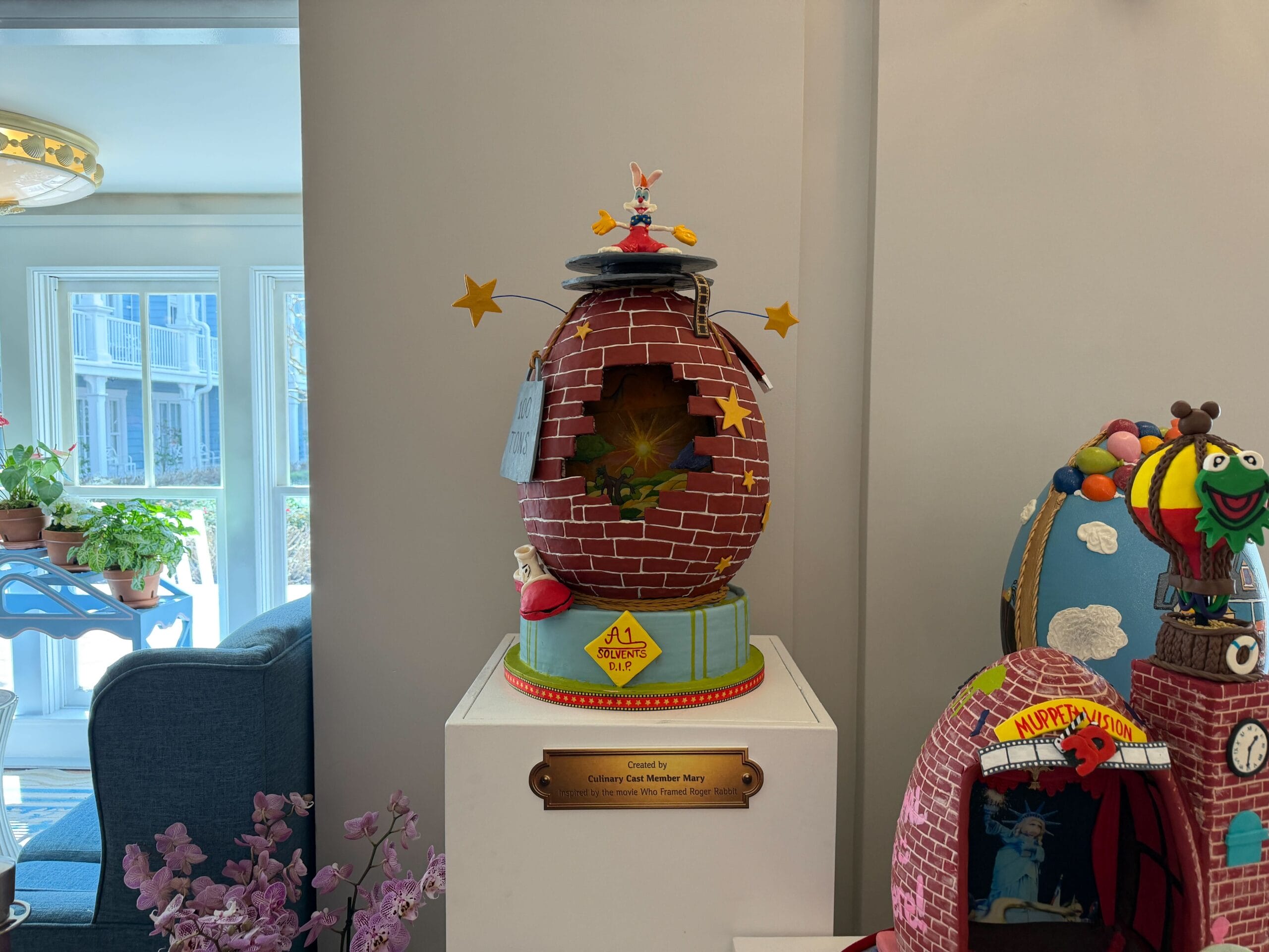 The second egg is inspired by the film Who Framed Roger Rabbit. The egg has a brick pattern, reminiscent of the warehouse in the climax, as through a hole in the wall, Toontown is visible. The dip is dripping from the egg, with a yellow sign that reads 'A1 Solvents D.I.P.' in the middle. The shoe that gets dissolved is present near the bottom.