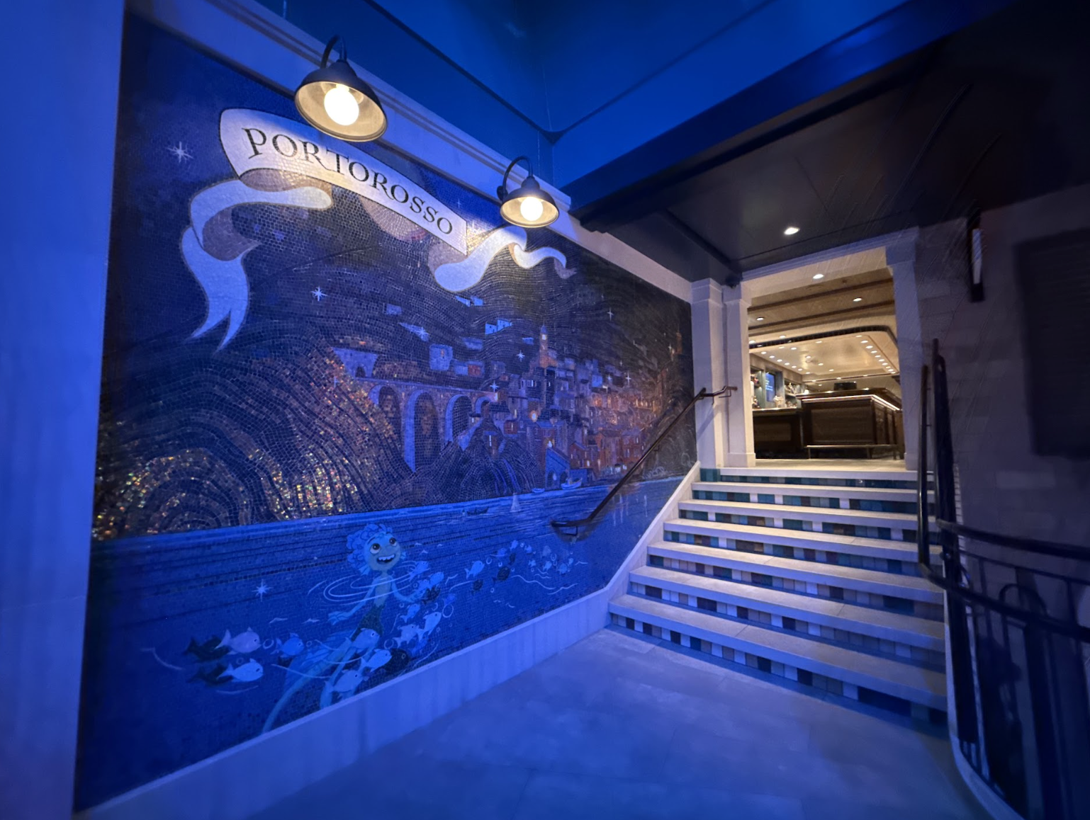 Under dim lighting, the entryway looks almost as though it is underwater, bringing guests up to the surface.