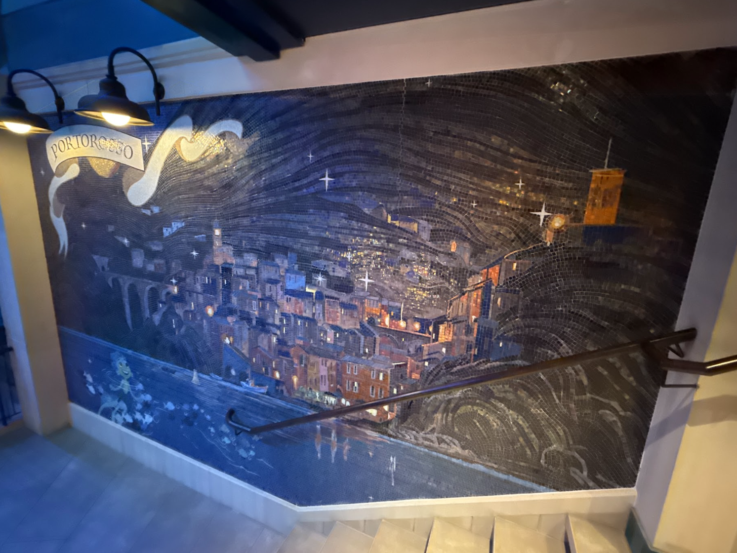 Similarly, as you descend the stairs, it looks as though you are going back into the ocean as the town of Portorossa shines beyond on the wall mural.