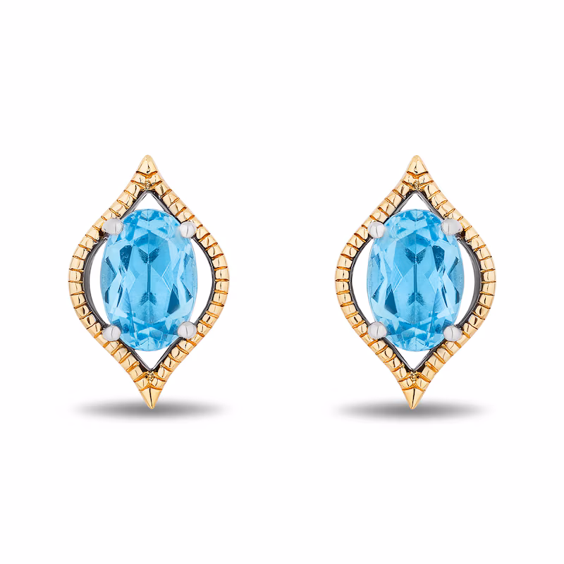 These earrings, inspired by Jasmine's aesthetic, center on oval-shaped, Swiss blue topaz held by a marquise frame. The frame comprises sterling silver and 10K gold.