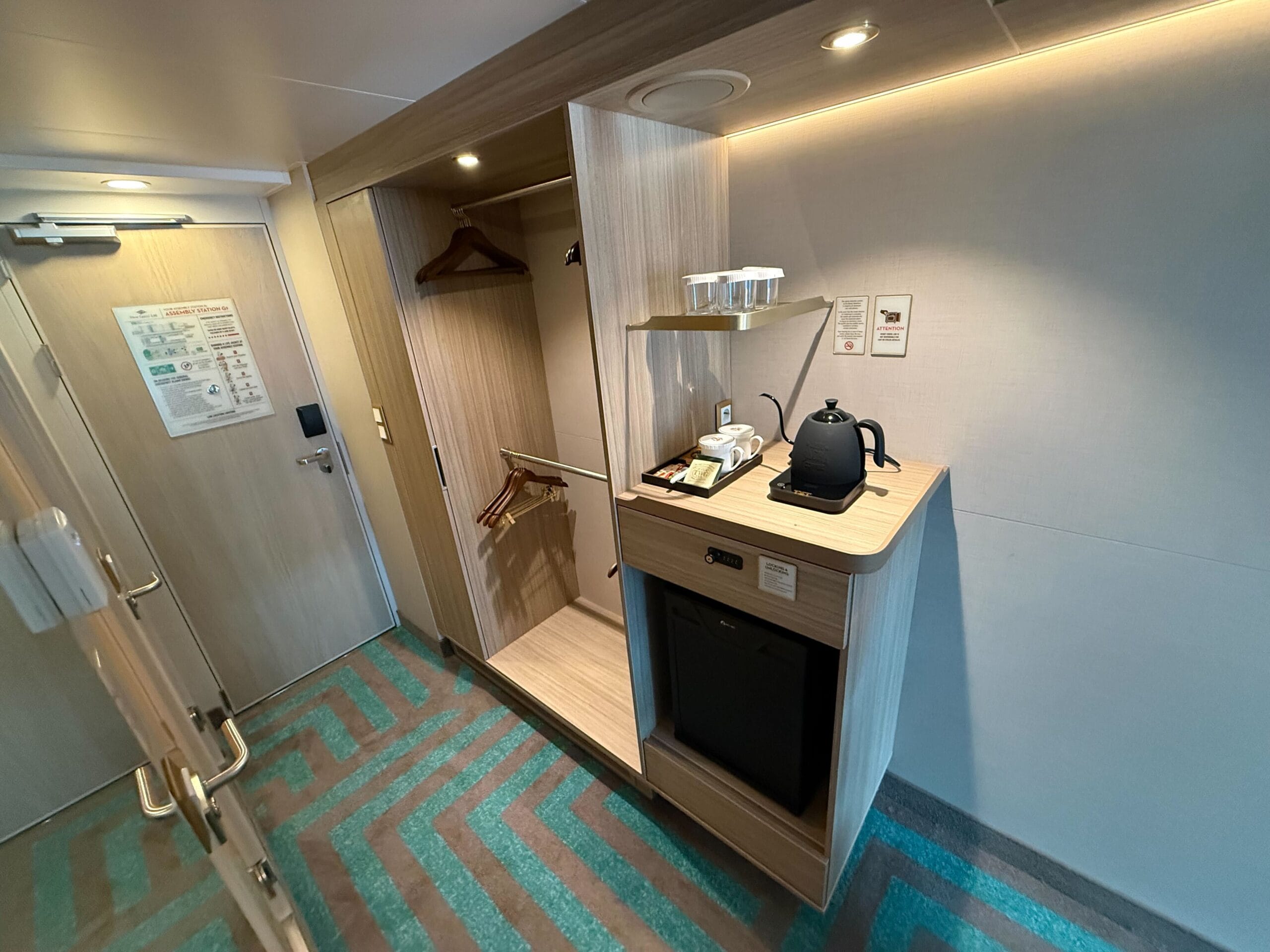 Deluxe Reef View Stateroom with Verandah closet and coffee station