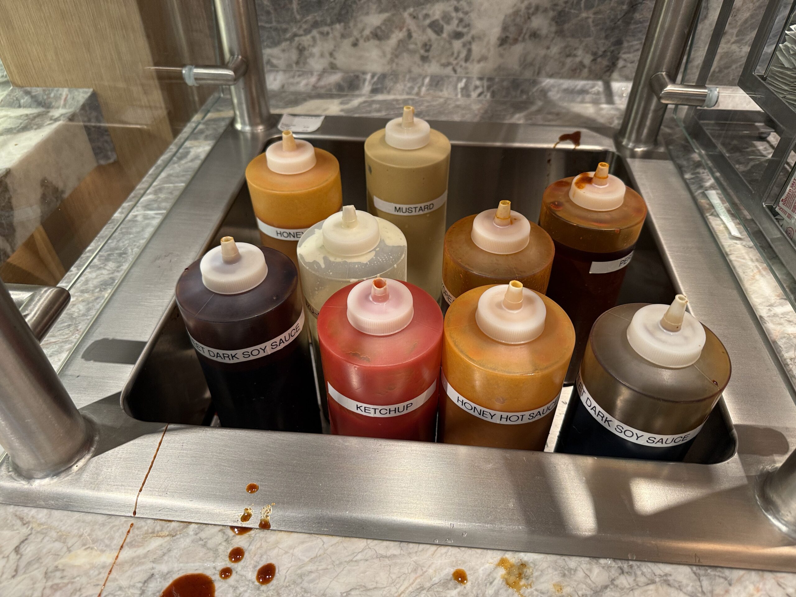Condiments sauces include Sweet Dark Soy Sauce, Ketchup, Honey Hot Sauce, and Mustard.