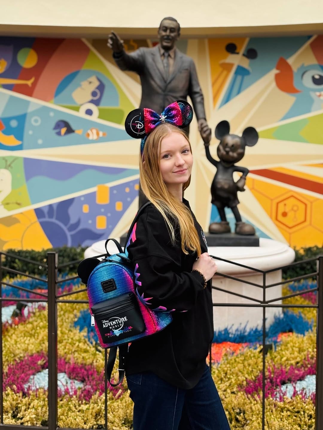 To go along with the apparel, a multi-colored Loungefly backpack with the Disney Adventure World logo on it is also available. The color scheme of the bag matches the apparel items. A Minnie ear headband with corresponding colors is also available.