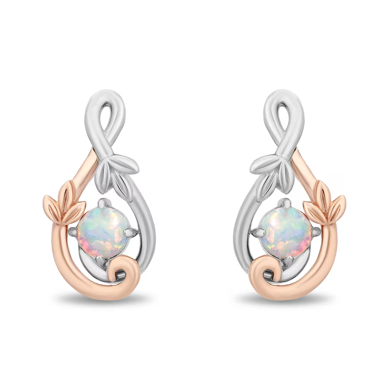 This earring and necklace set comprises lab-created opals set in a shimmering sterling silver and 14k rose gold plating. The two-tone setting looks like vines with two sets of leaves, one in rose gold and the other in silver.