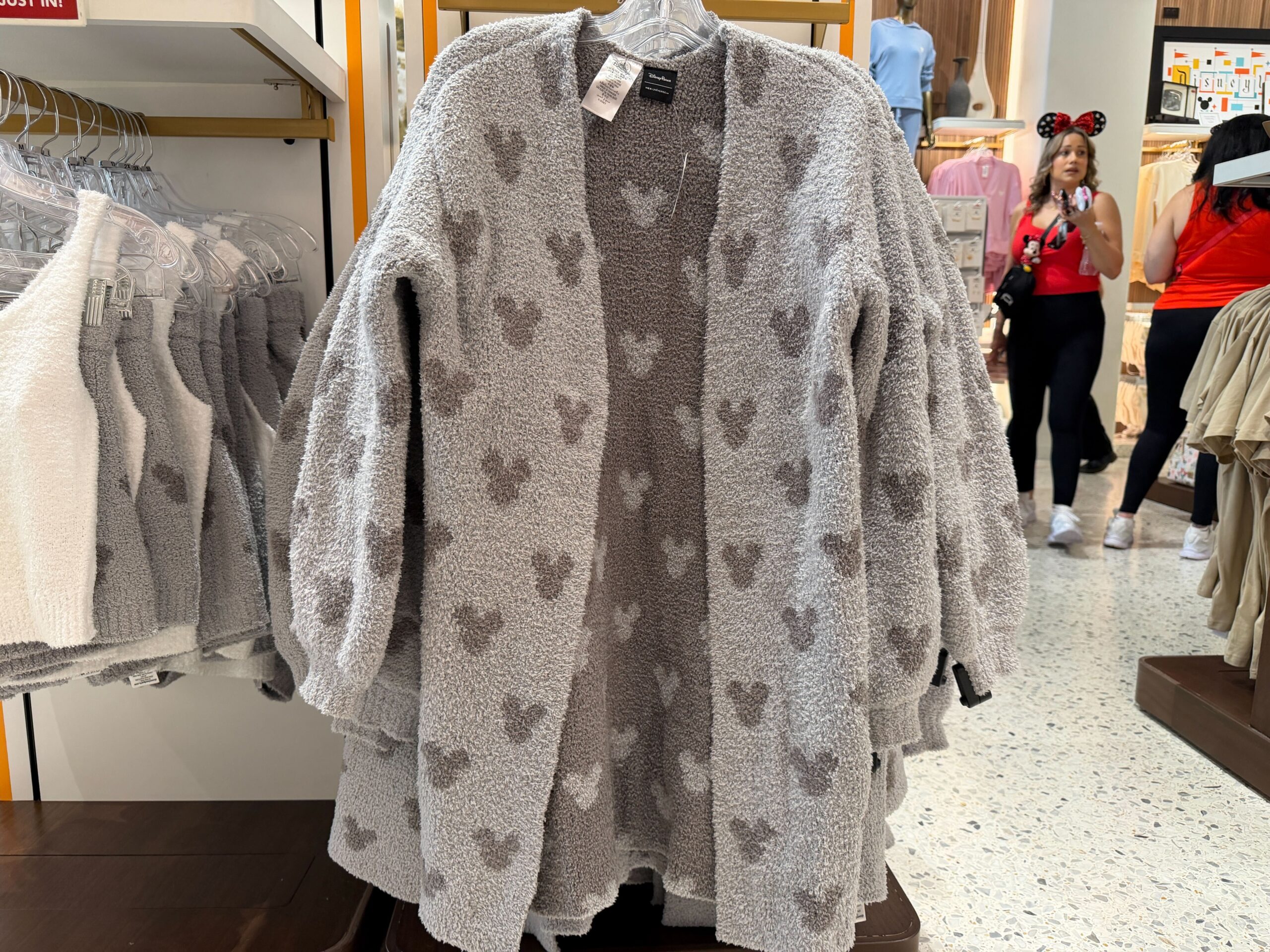 Finally, this cardigan matches the shorts above. The interior of the cardigan has the opposite color scene with light grey Mickey head icons against a dark grey background.