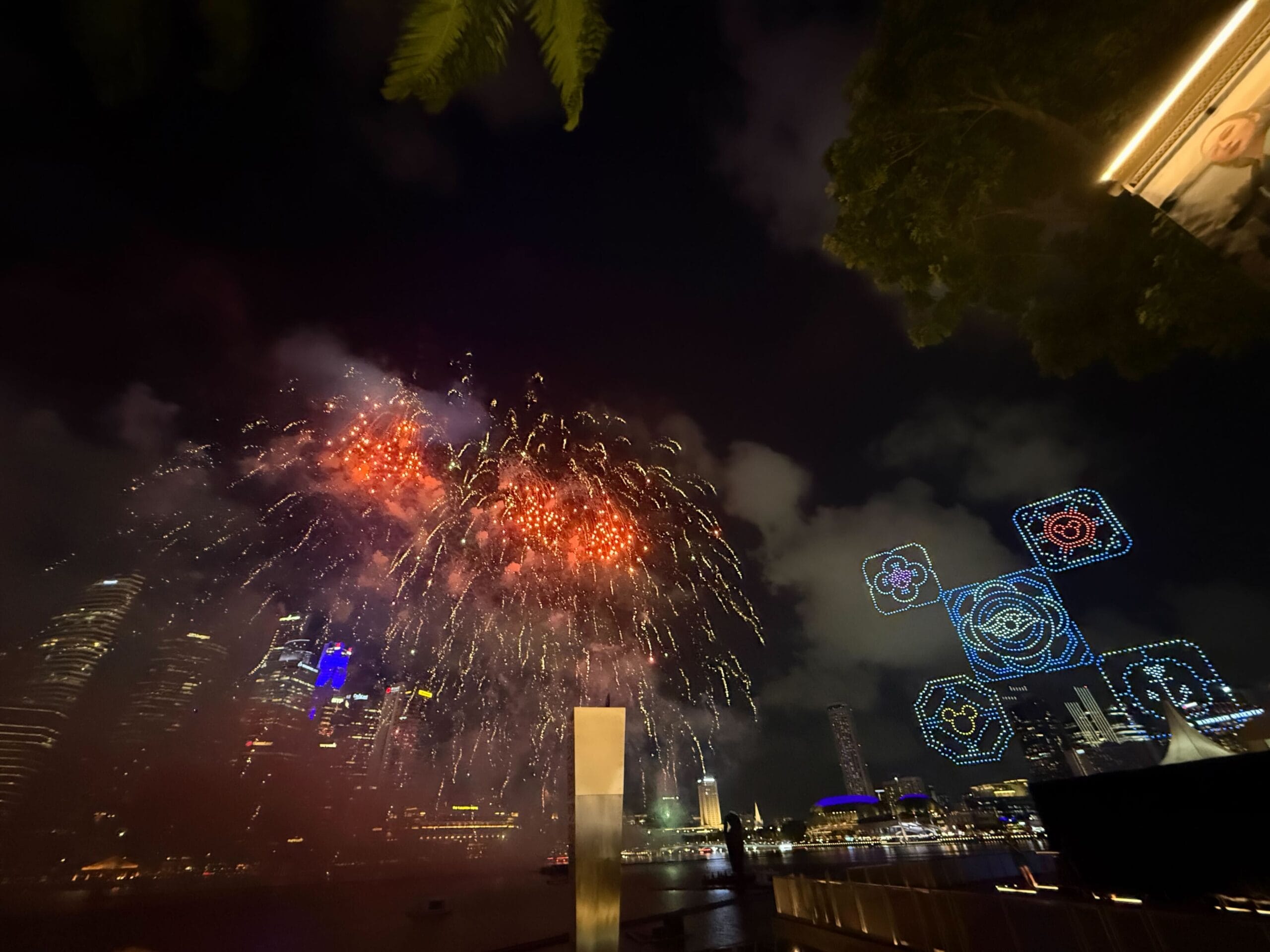 The finale of the celebration includes a cascade of multicolored fireworks, joined by a collection of drones comprising Disney Cruise Line and Singapore symbols. According to Disney, there are five of them in recognition of the Disney Adventure's five-year commitment to The Marina Bay Cruise Centre Singapore. These five symbols include Disney Cruise Line and nautical-themed elements with Peranakan-inspired motifs and icons referencing Singapore’s National Flower, the Vanda Miss Joaquim.