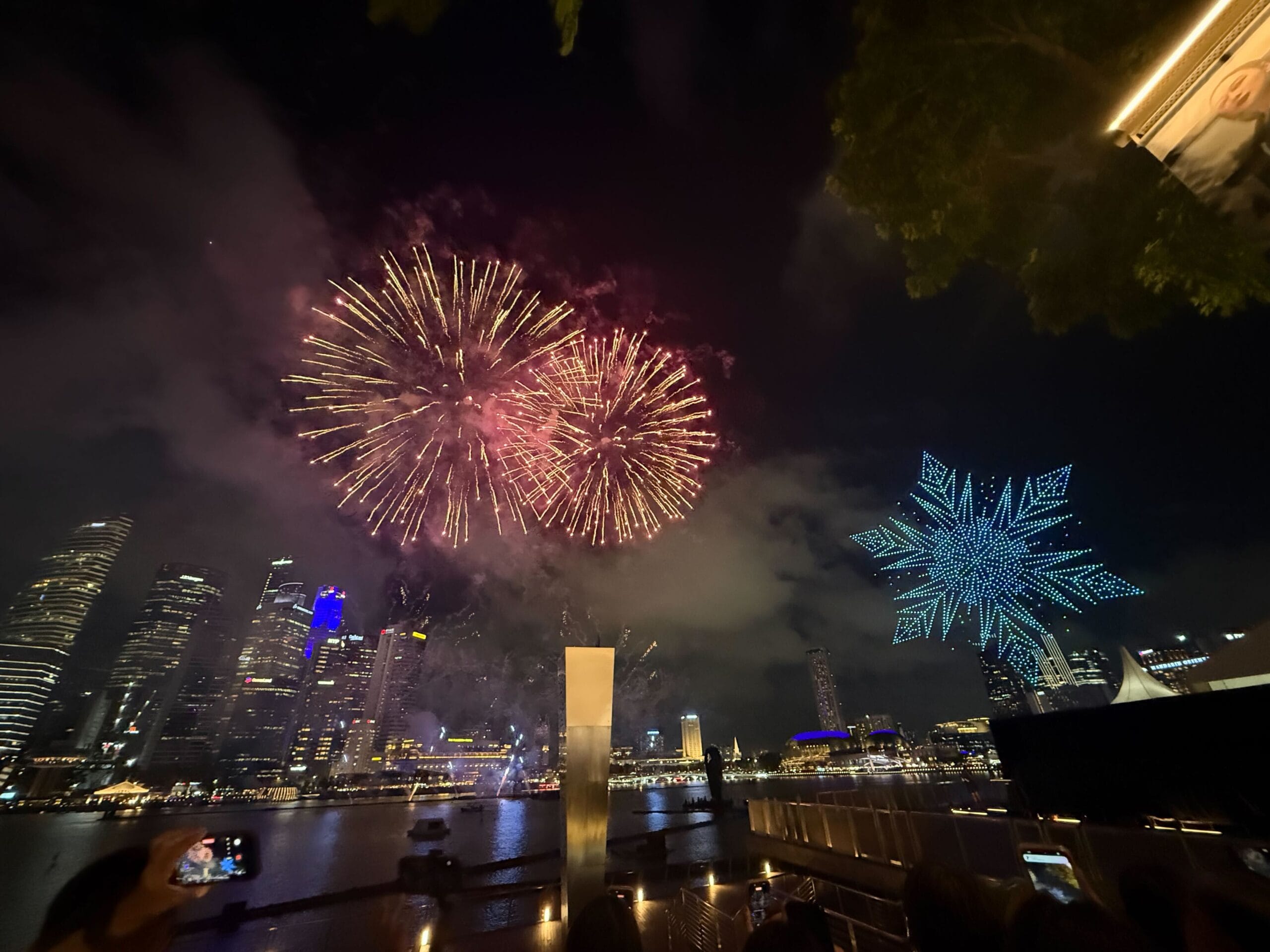 Fireworks are soon joined by more drones. This time in shades of blue forming a giant snowflake, representing Elsa's powers from Frozen.