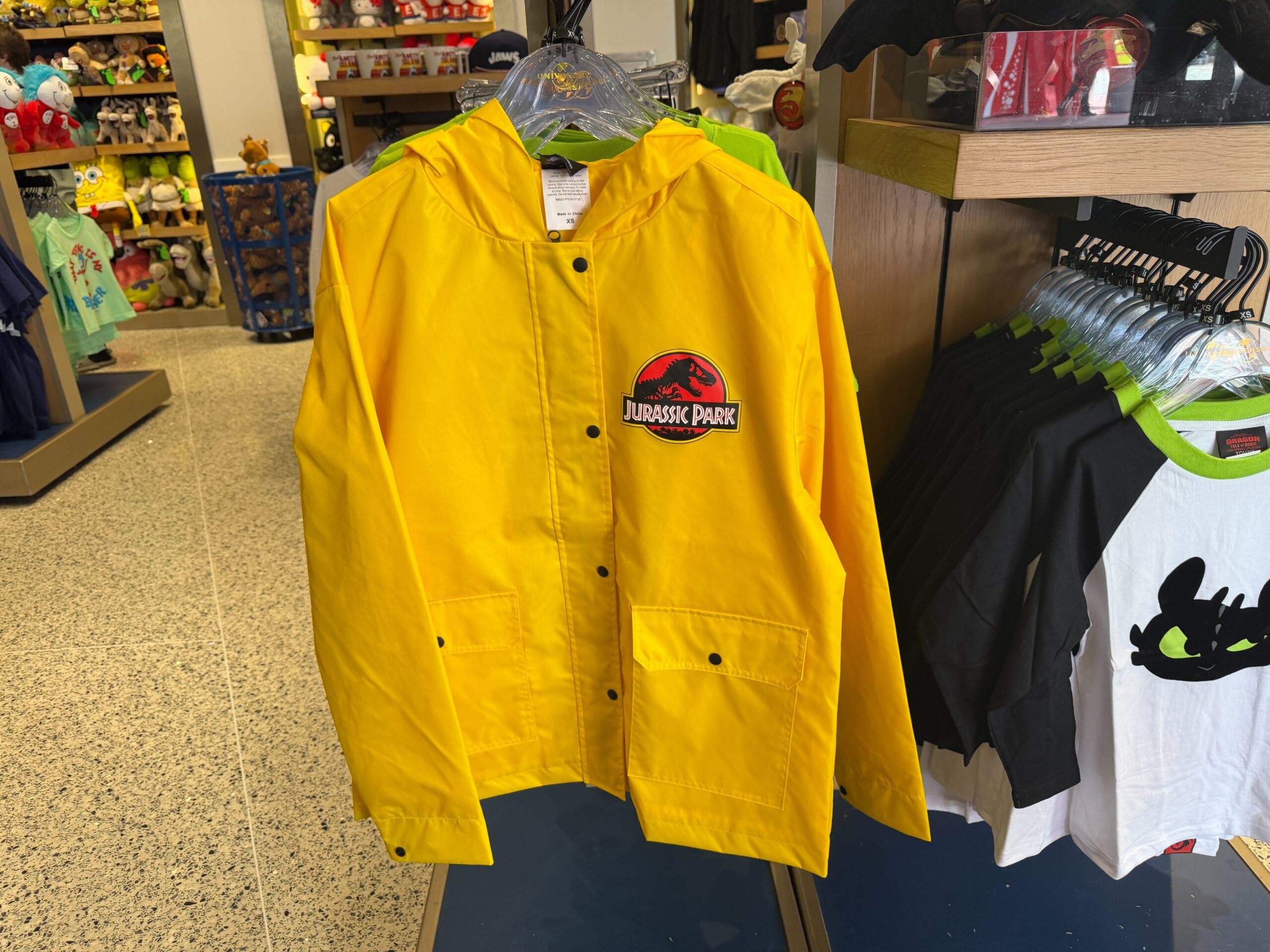 Stay Dry in This ‘Jurassic Park’ Rain Jacket & Carry a Smaller Keychain Version in Your Pocket
