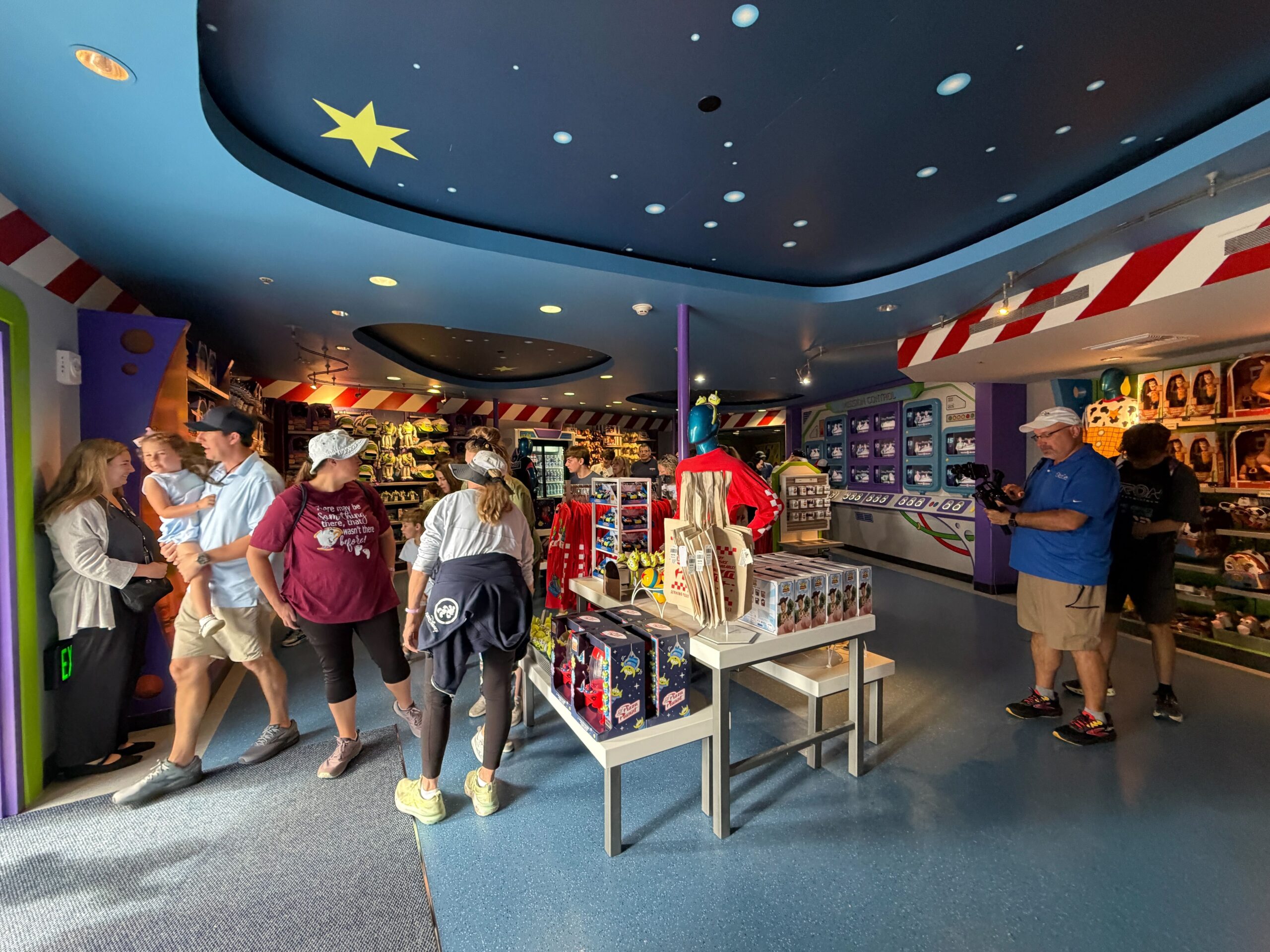The attraction's gift shop still has the red and white stripes on the wall, but it appears that the ceiling and flooring are a lighter shade of blue.