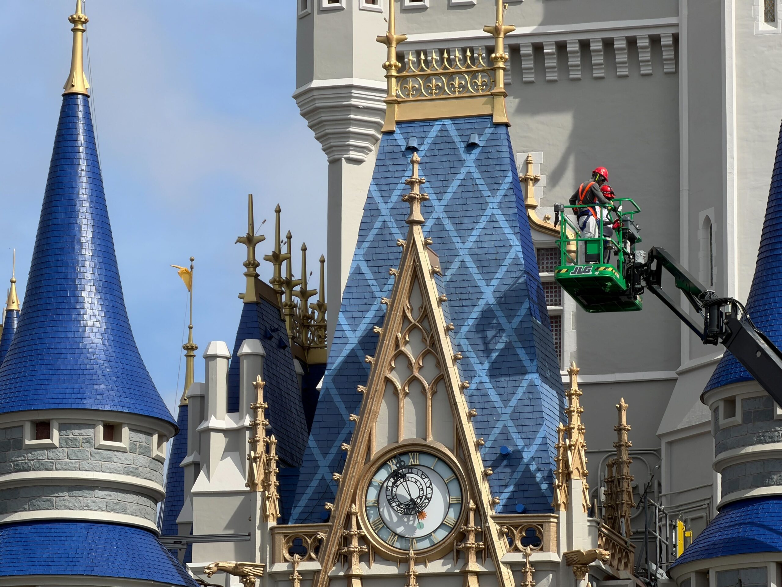 Crews continue to focus on the blue roofing of Cinderella Castle at Magic Kingdom, moving toward the blue towers with the patterns.