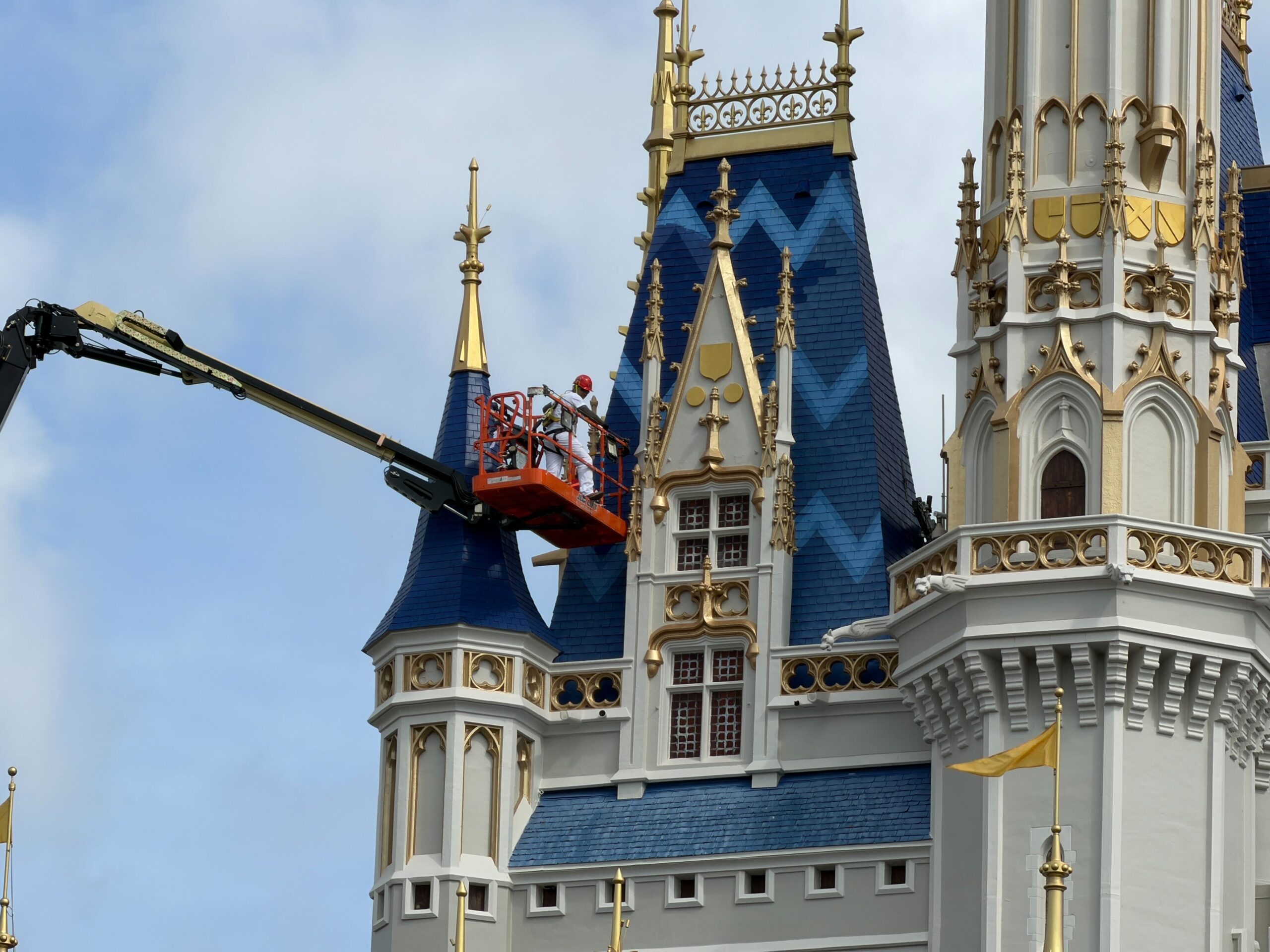 Crews continue to focus on the blue roofing of Cinderella Castle at Magic Kingdom, moving toward the blue towers with the patterns.