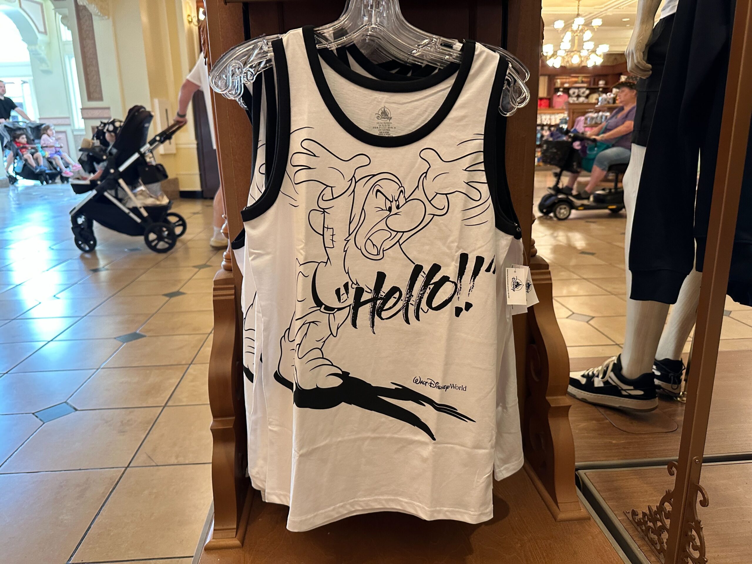 Grumpy from Snow White and the Seven Dwarfs is pictured yelling "Hello!!" on this black and white tank.
