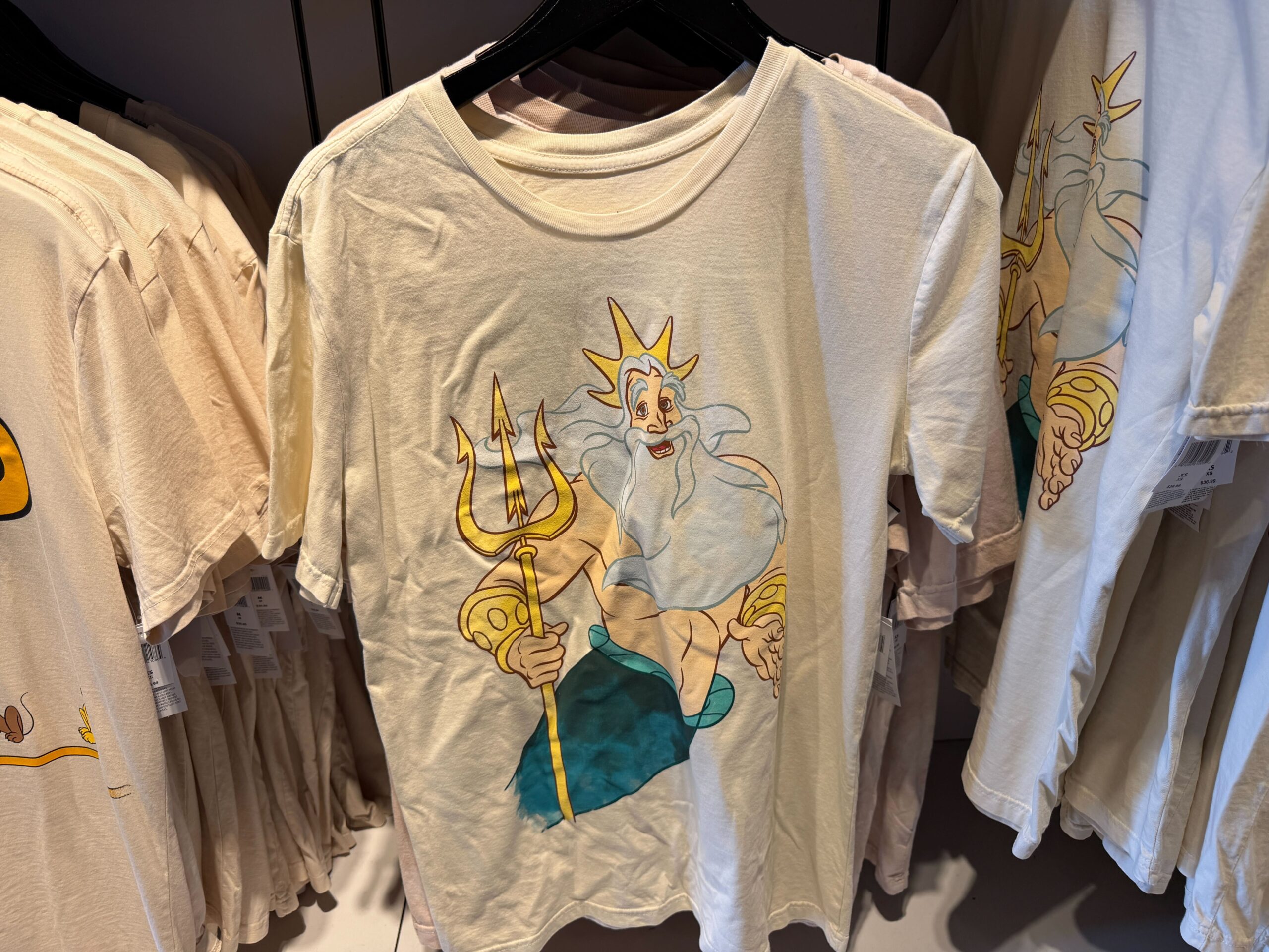 King Triton from The Little Mermaid is pictured on the front of this t-shirt. On the back in big block letters is "My Ocean, My Rules."