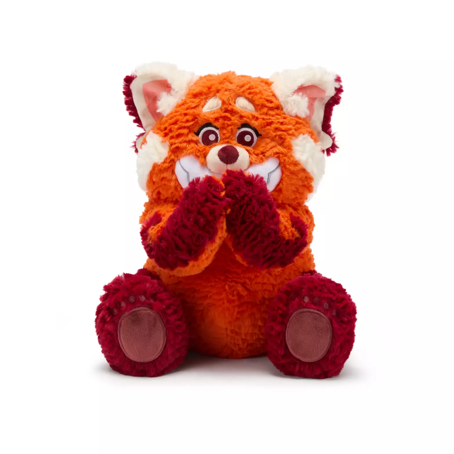 The soft orange and burgundy battery-operated Panda Mei plush also holds her hands in front of her face. She has a huge smile on her face and large, embroidered burgundy eyes. The left hand has a button that allows the plush to wiggle and giggle. This plush is rated for kids aged 2+.