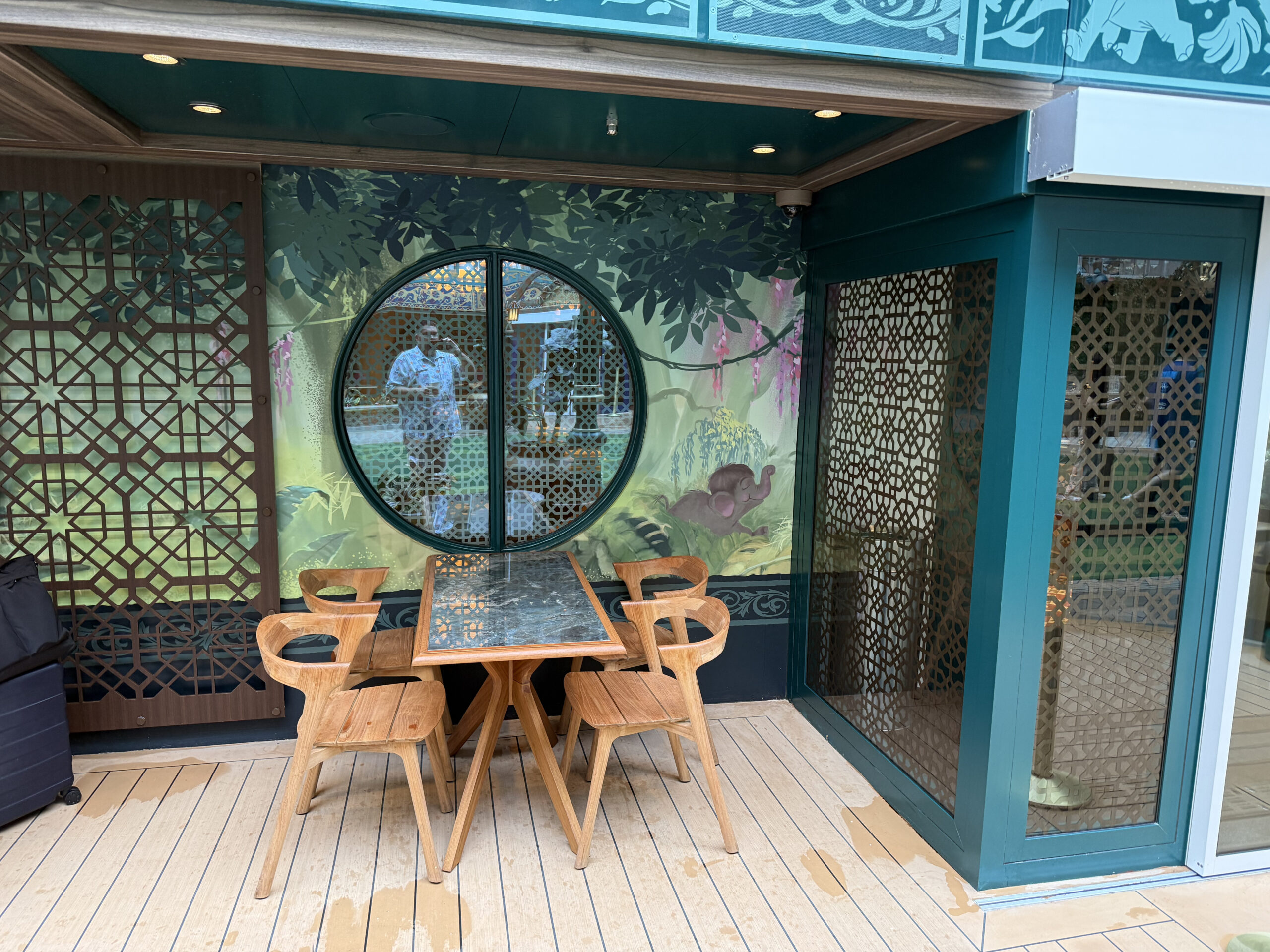 On either side of the entrance, The Jungle Book-themed murals show jungle scenes, including one with a baby elephant.