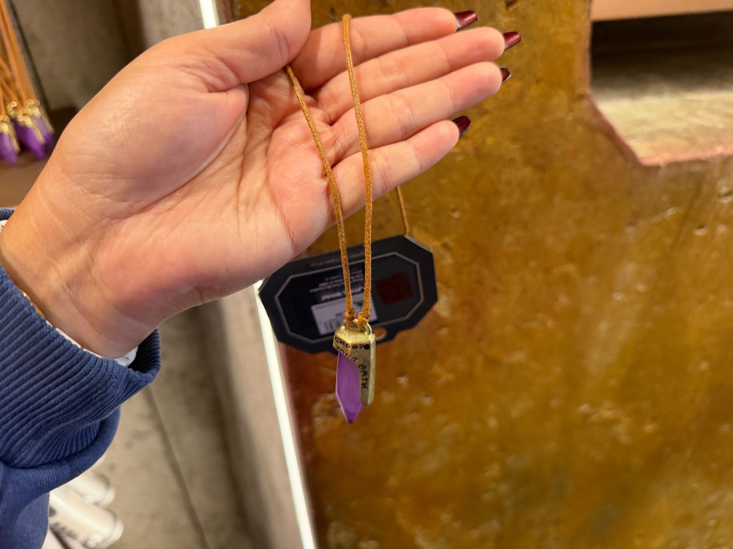 Purple kyber crystal necklace in Star Wars: Galaxy's Edge at Disney's Hollywood Studios in Walt Disney World